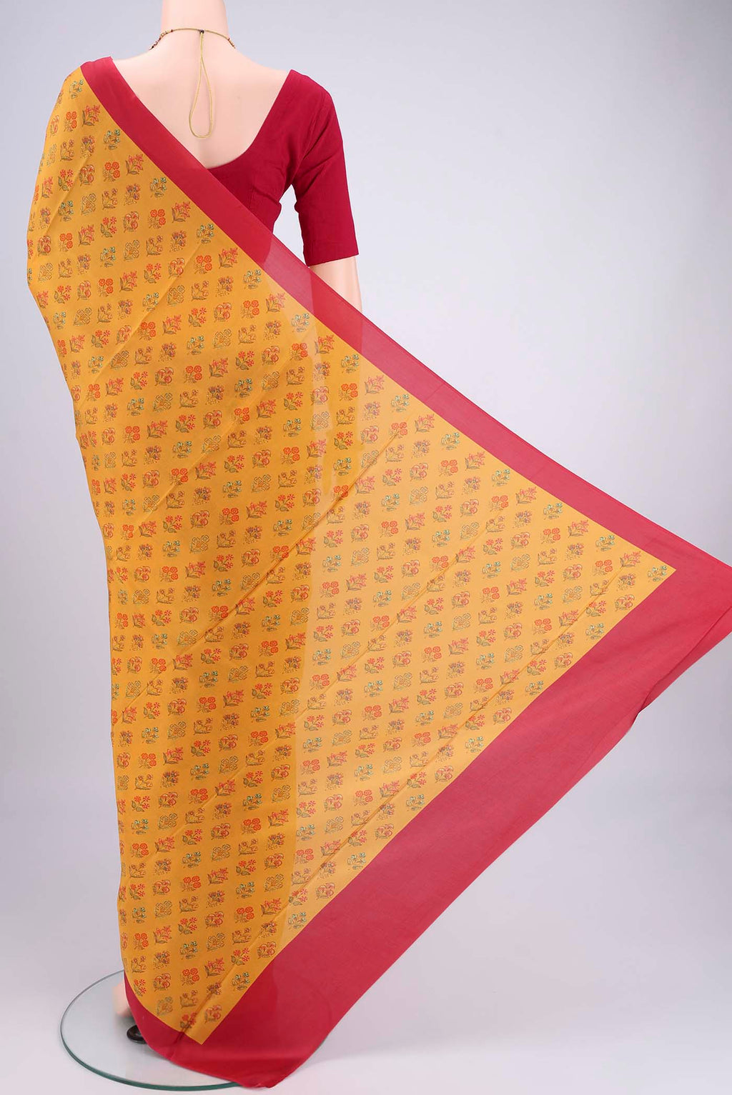 Flat view of Mustard Printed Silk Saree with Floral Print on the body and Printed Border. 