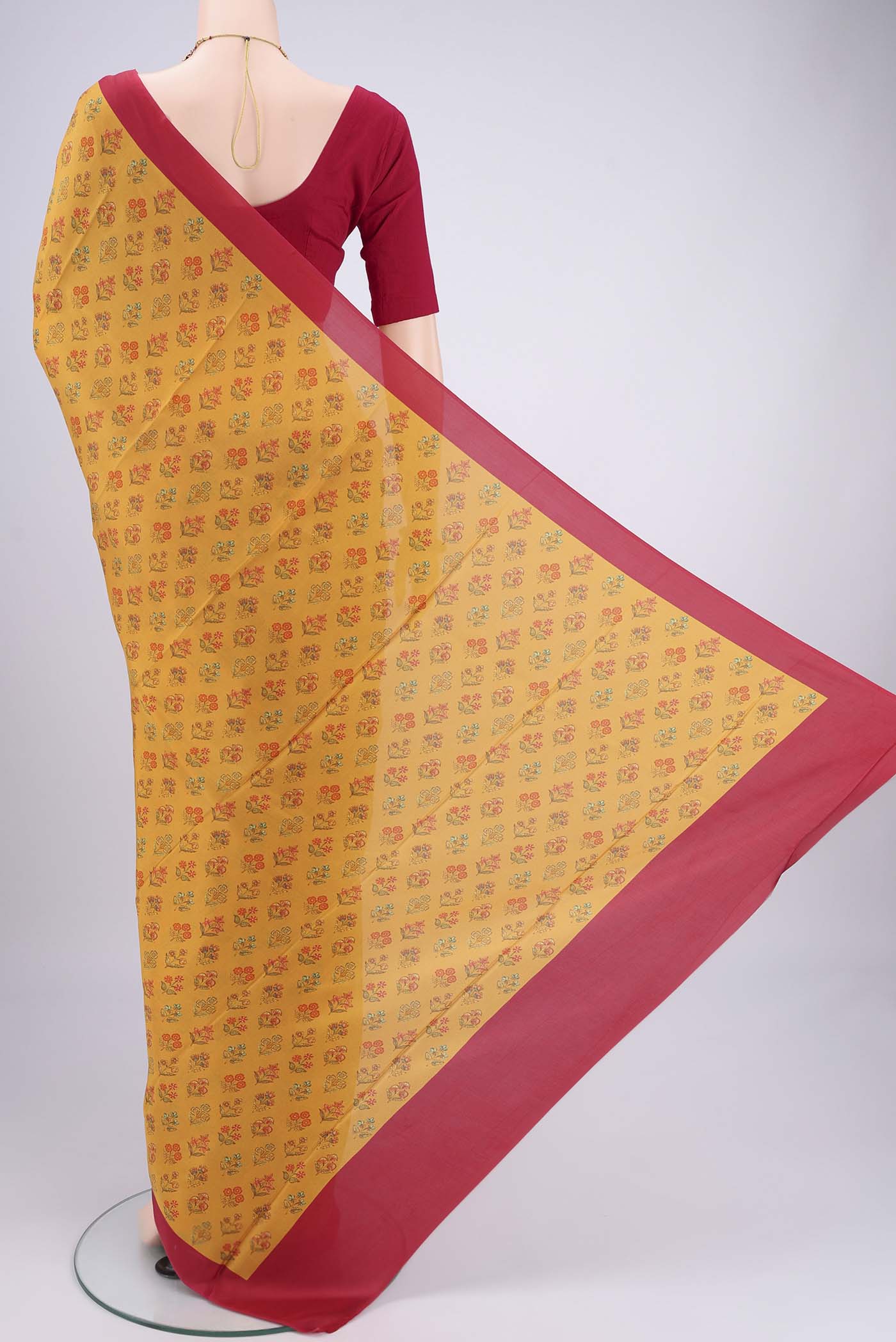 Flat view of Mustard Printed Silk Saree with Floral Print on the body and Printed Border. 