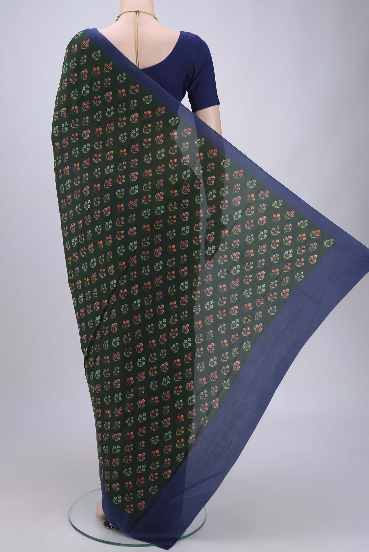 Flat view of Bottle Green Printed Silk Saree with Printed design on the body and Plain Border. 