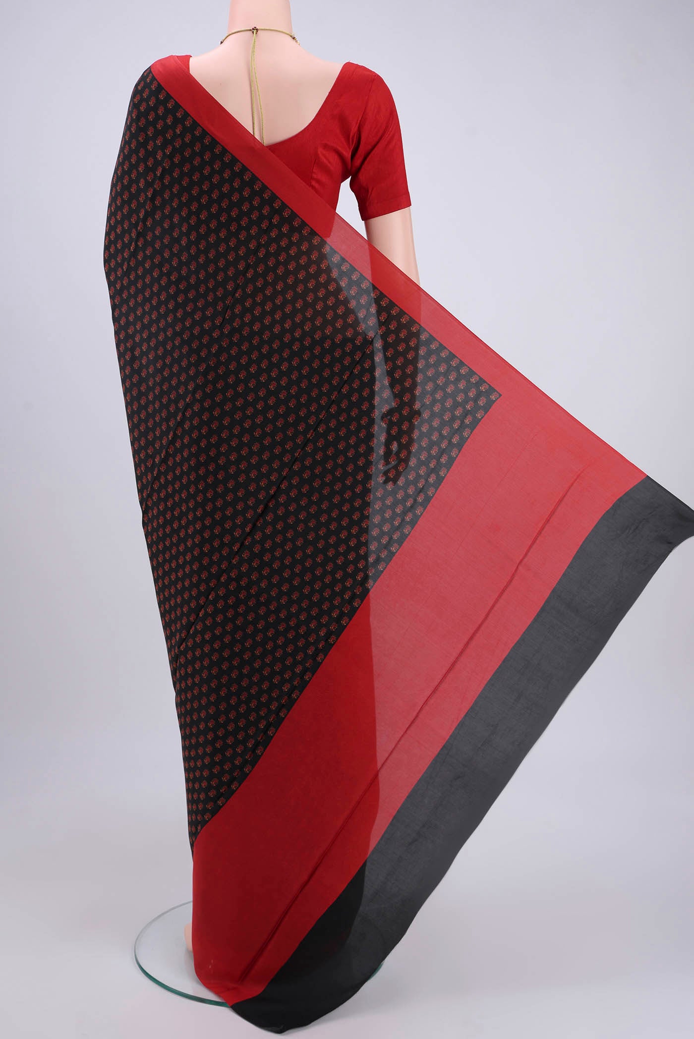 Flat view of Black Printed Silk Saree with Printed design on the body and Plain Border. 