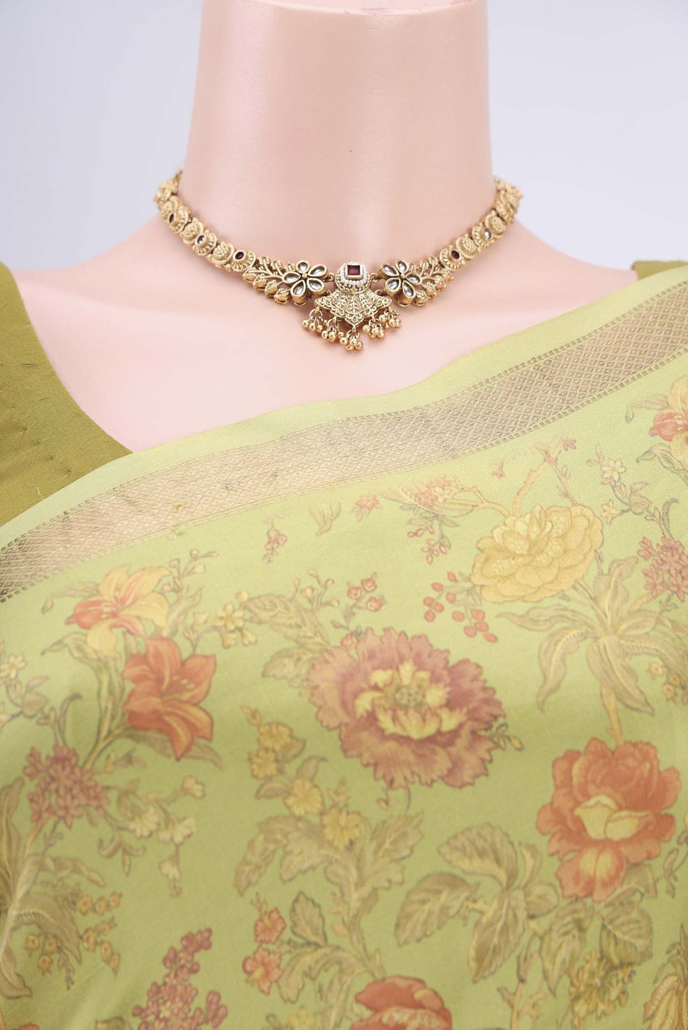 Border image of Light Green Crepe Saree with Floral Print on the body and Plain Border. 
