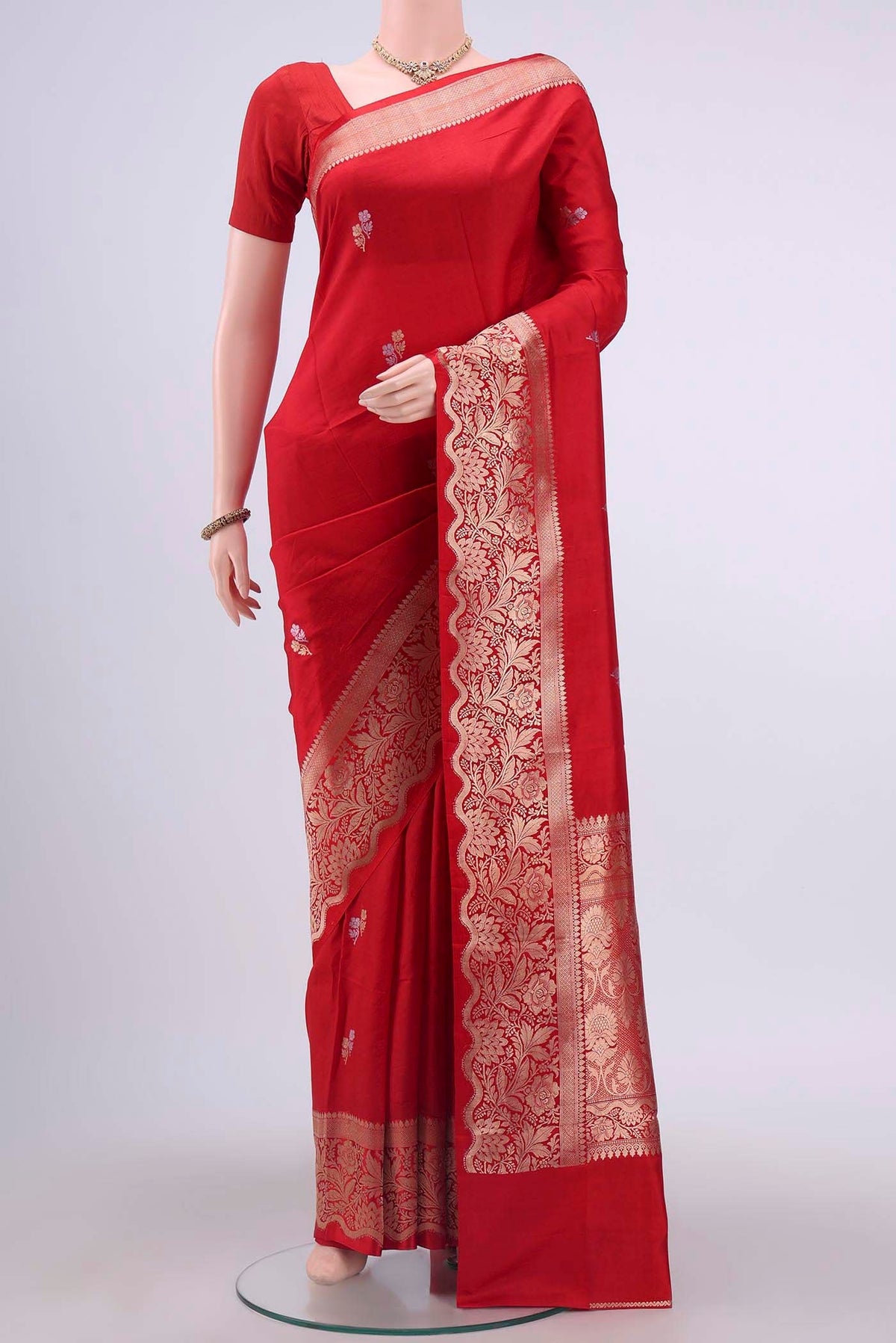Red Banarasi Katan Silk Saree with Zari Butta on the body and Zari Border displayed on a mannequin