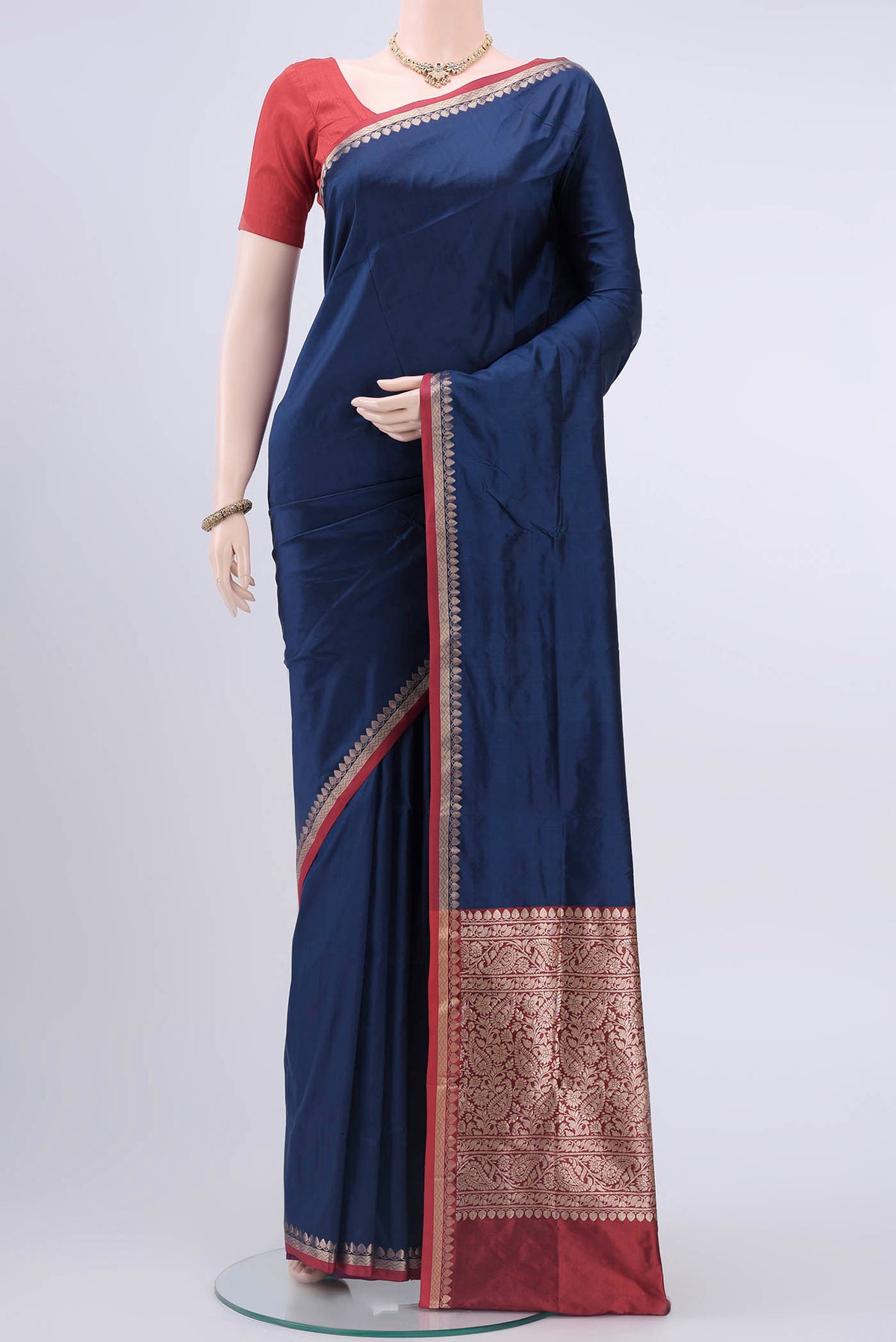 Navy Blue Banarasi Katan Silk Saree with Plain Body and Zari Border displayed on a mannequin