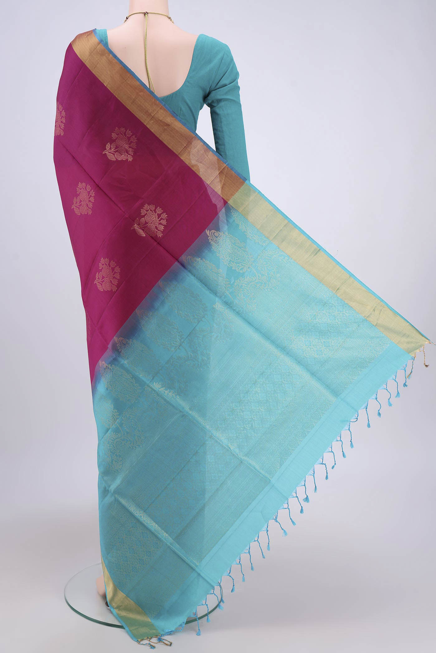 Flat view of Magenta Soft Silk Saree with Zari Butta on the body and Zari Border. 