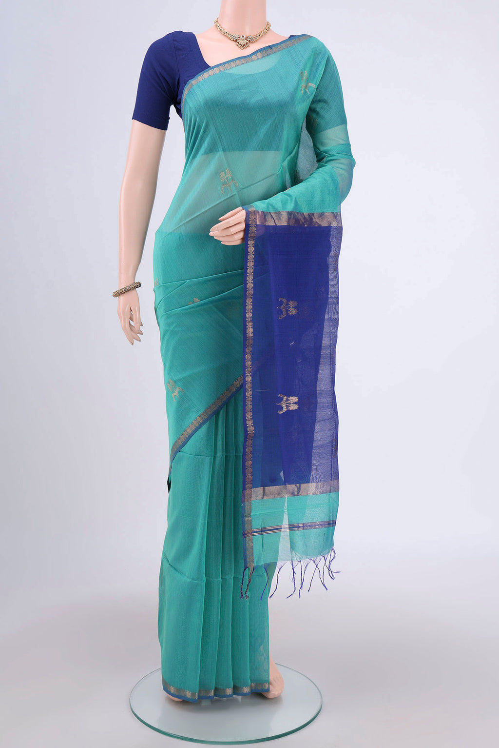 Dark Blue Maheshwari Silk Cotton Saree with Stripes on the body and Zari Border.  displayed on a mannequin