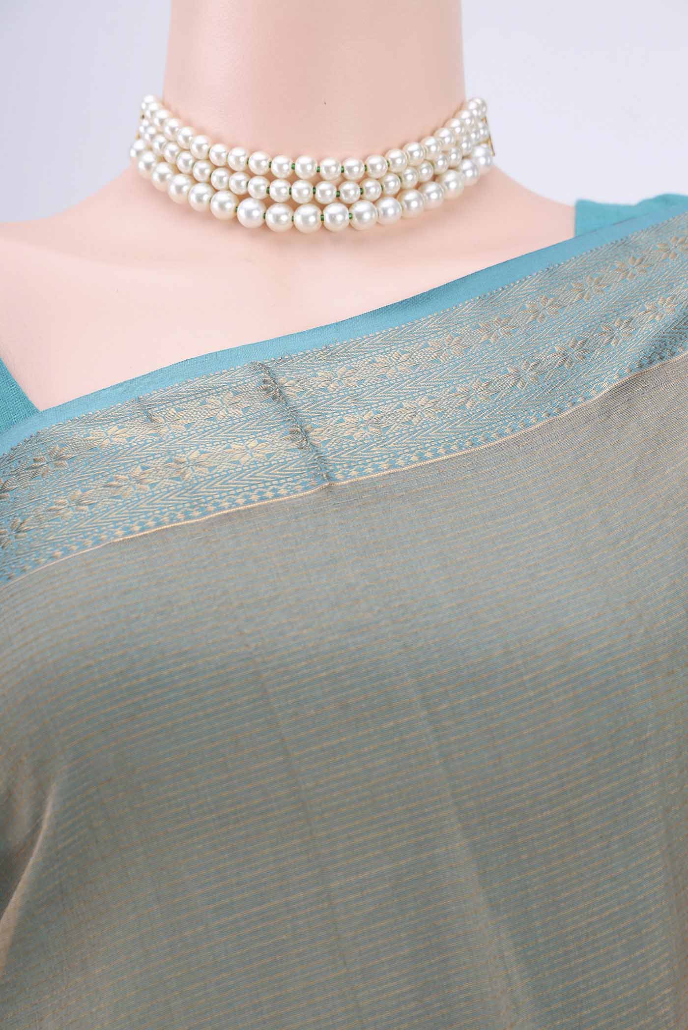 Border image of Dark Beige Maheshwari Silk Cotton Saree with Stripes on the body and Zari Border. 