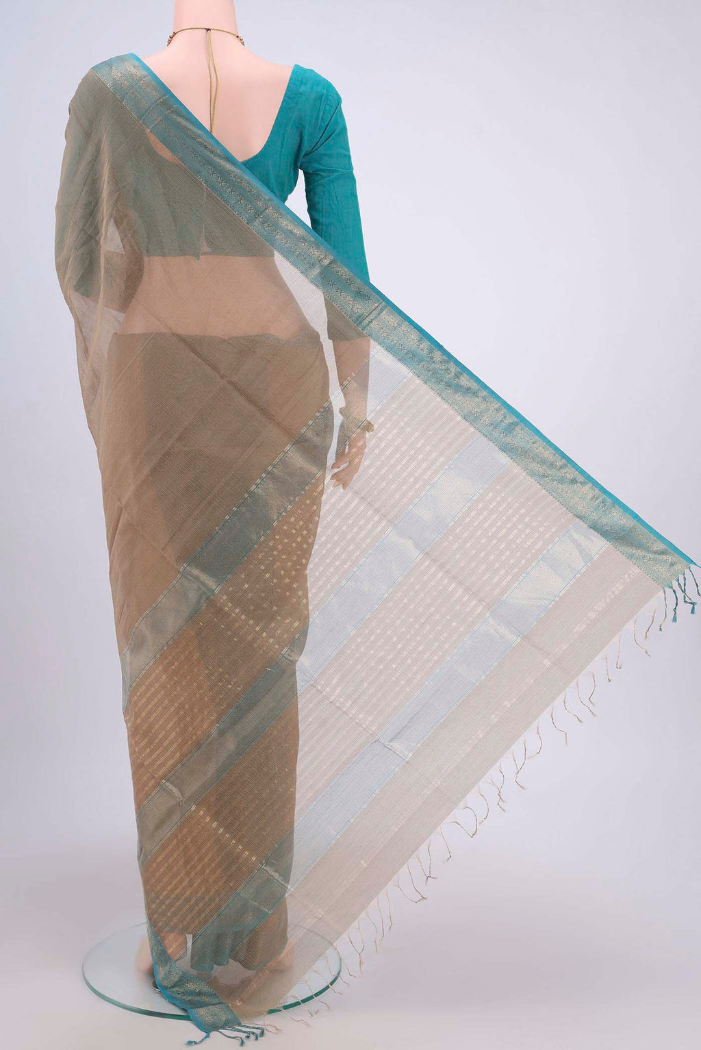 Flat view of Dark Beige Maheshwari Silk Cotton Saree with Stripes on the body and Zari Border. 