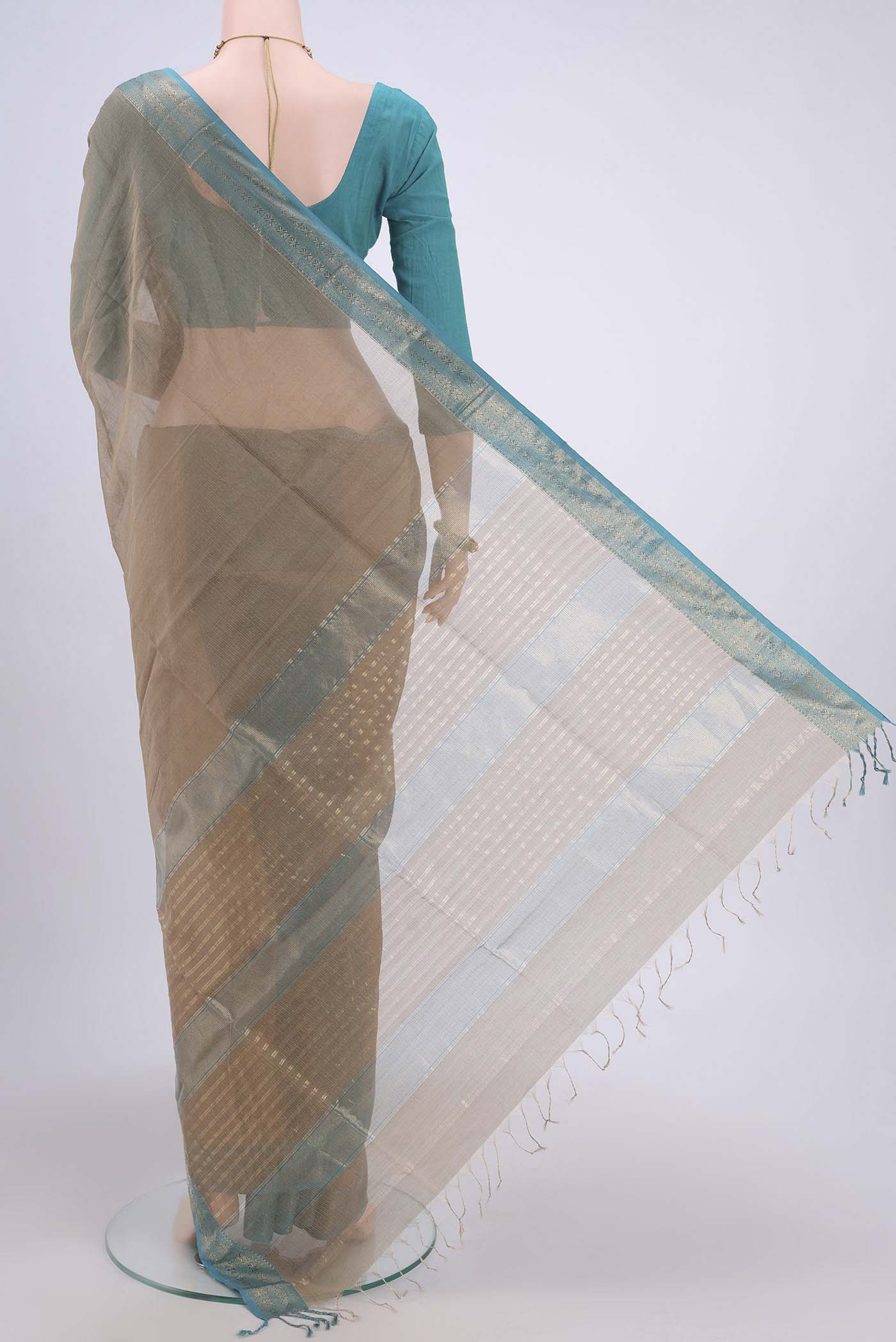 Flat view of Dark Beige Maheshwari Silk Cotton Saree with Stripes on the body and Zari Border. 