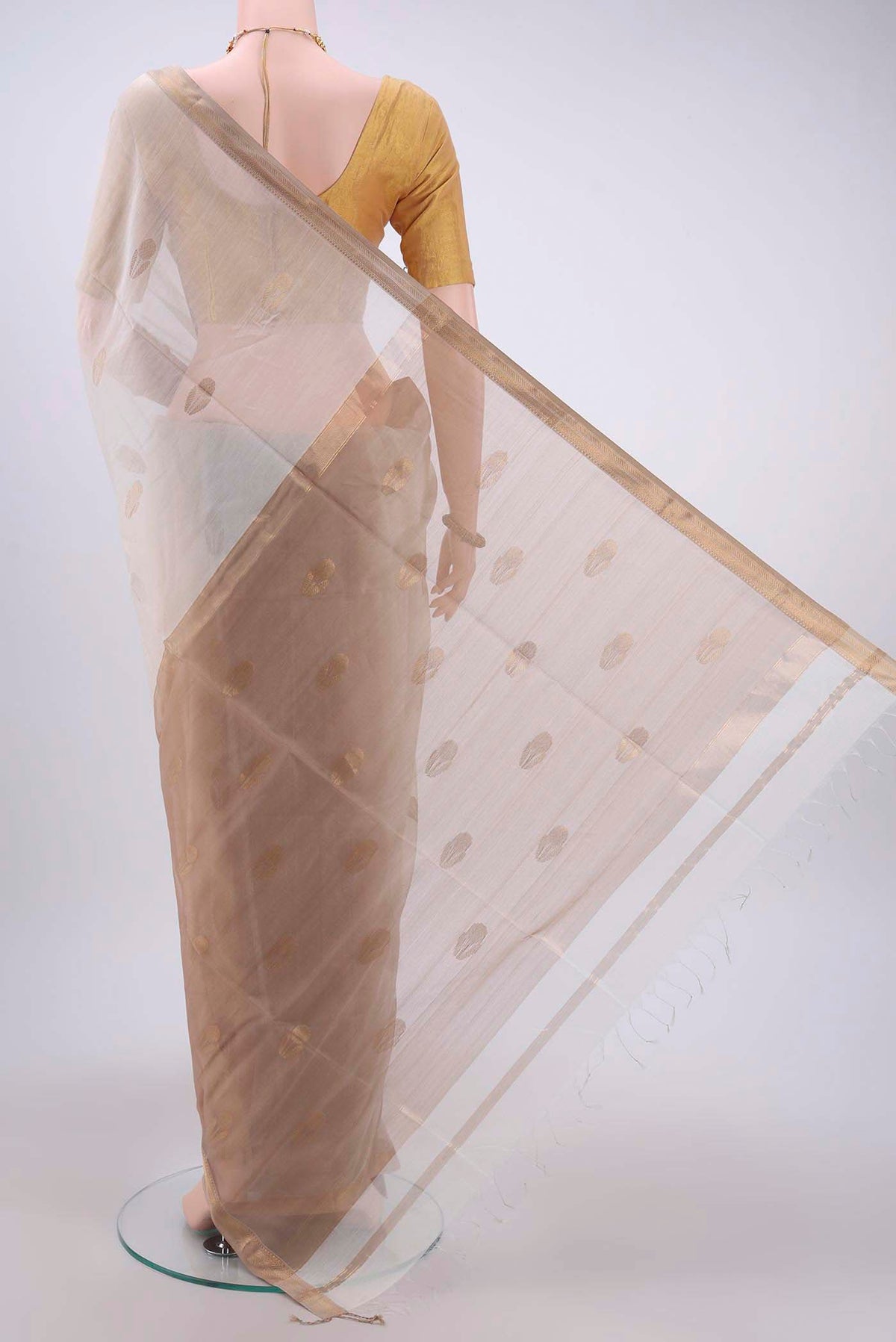 Flat view of White Maheshwari Silk Cotton Saree with Zari Butta on the body and Zari Border