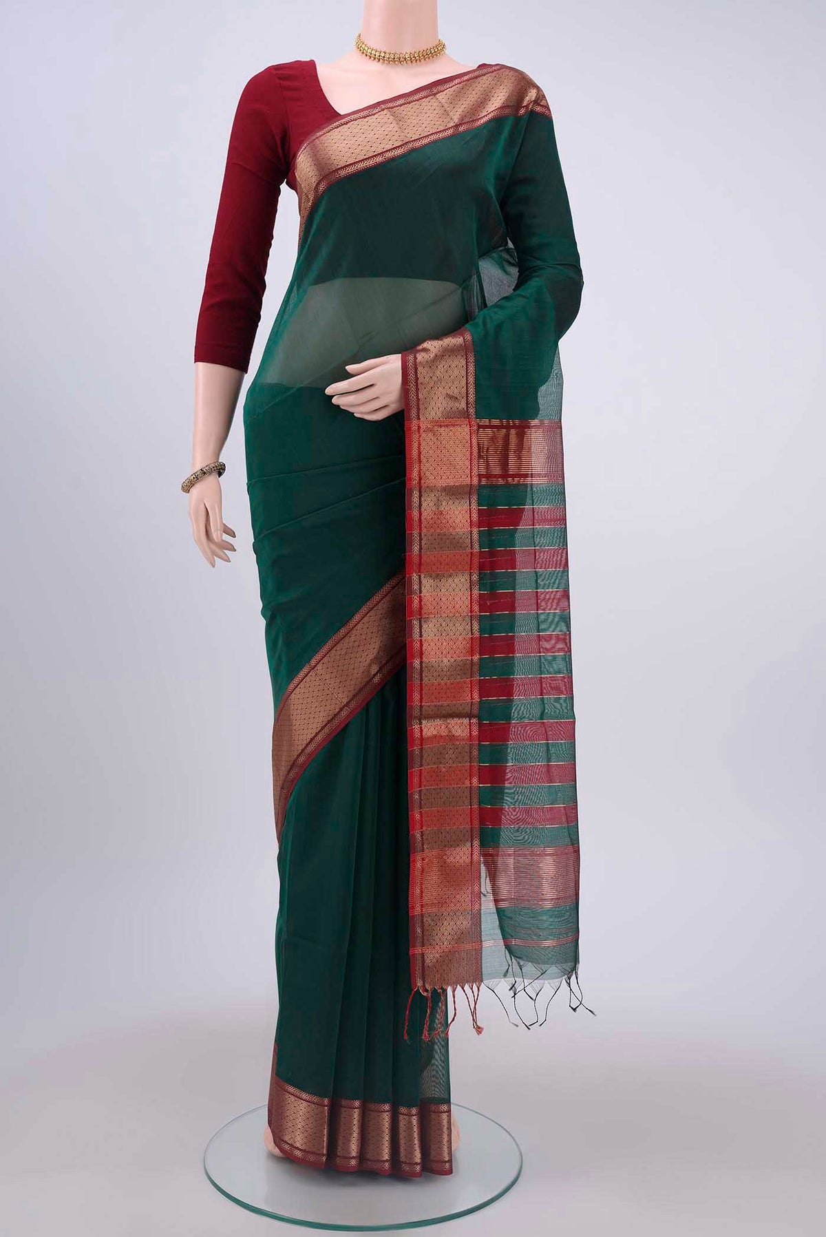 Green Maheshwari Silk Cotton Saree with Plain Body and Zari Border displayed on a mannequin