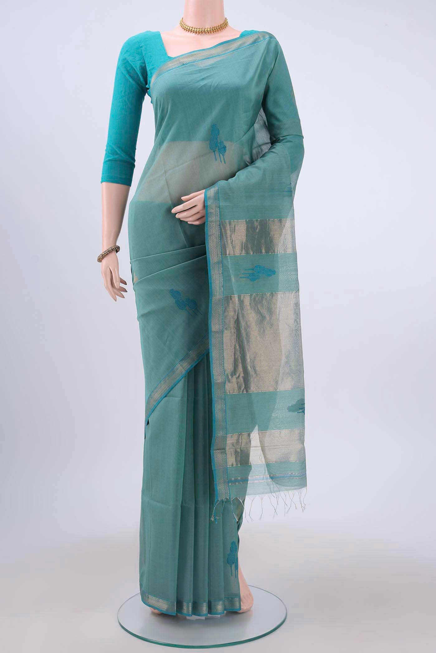Blue Maheshwari Silk Cotton Saree with Thread Butta on the body and Zari Border displayed on a mannequin