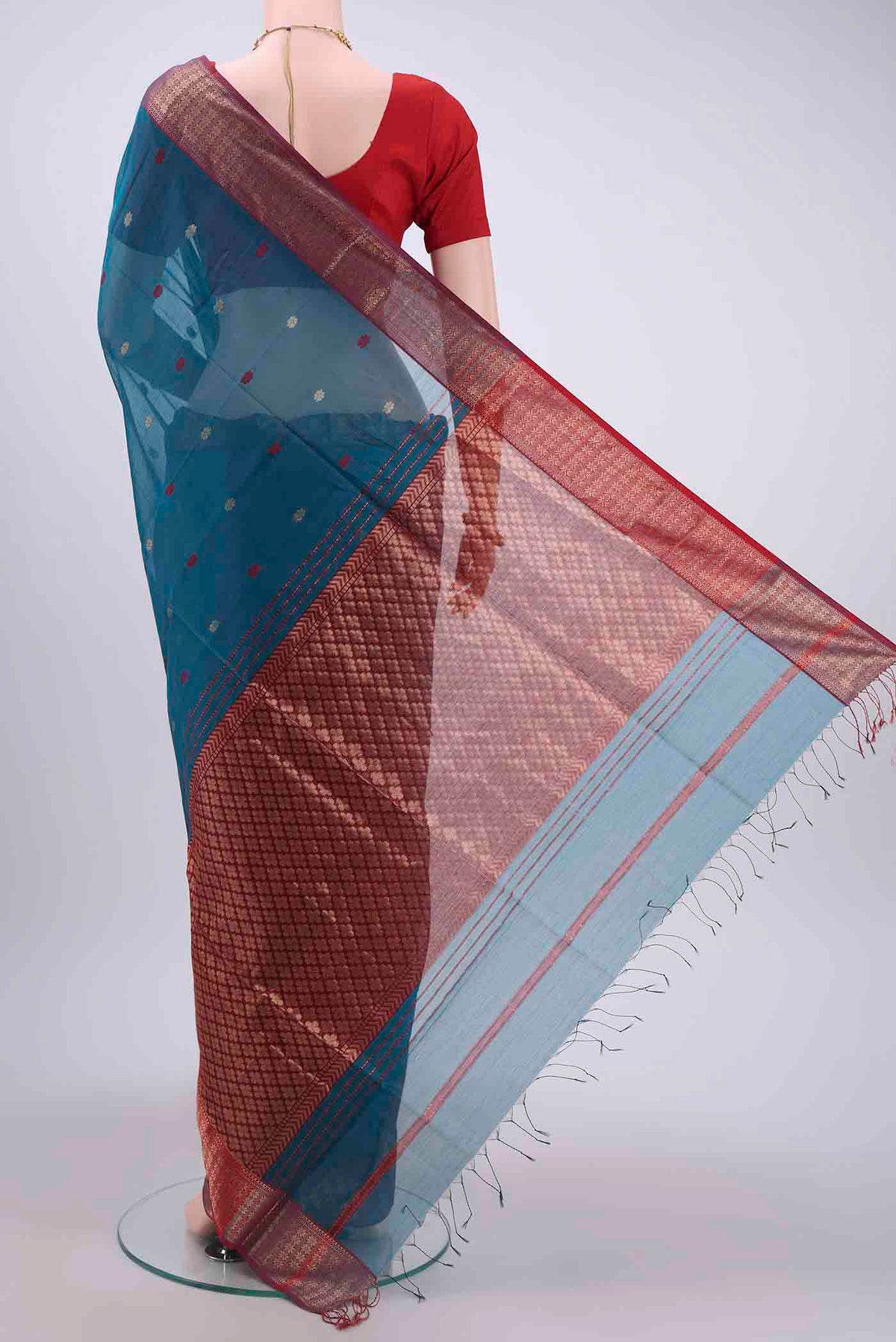 Flat view of Dark Blue Maheshwari Silk Cotton Saree with Zari And Thread Butta on the body and Zari Border