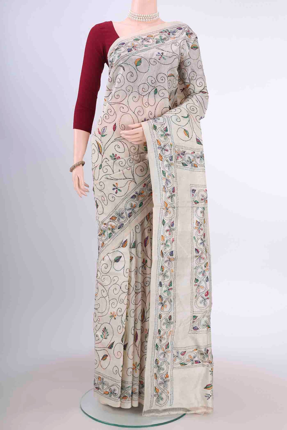 Beige Kantha Silk Saree with Kantha Work on the body and Thread Border displayed on a mannequin