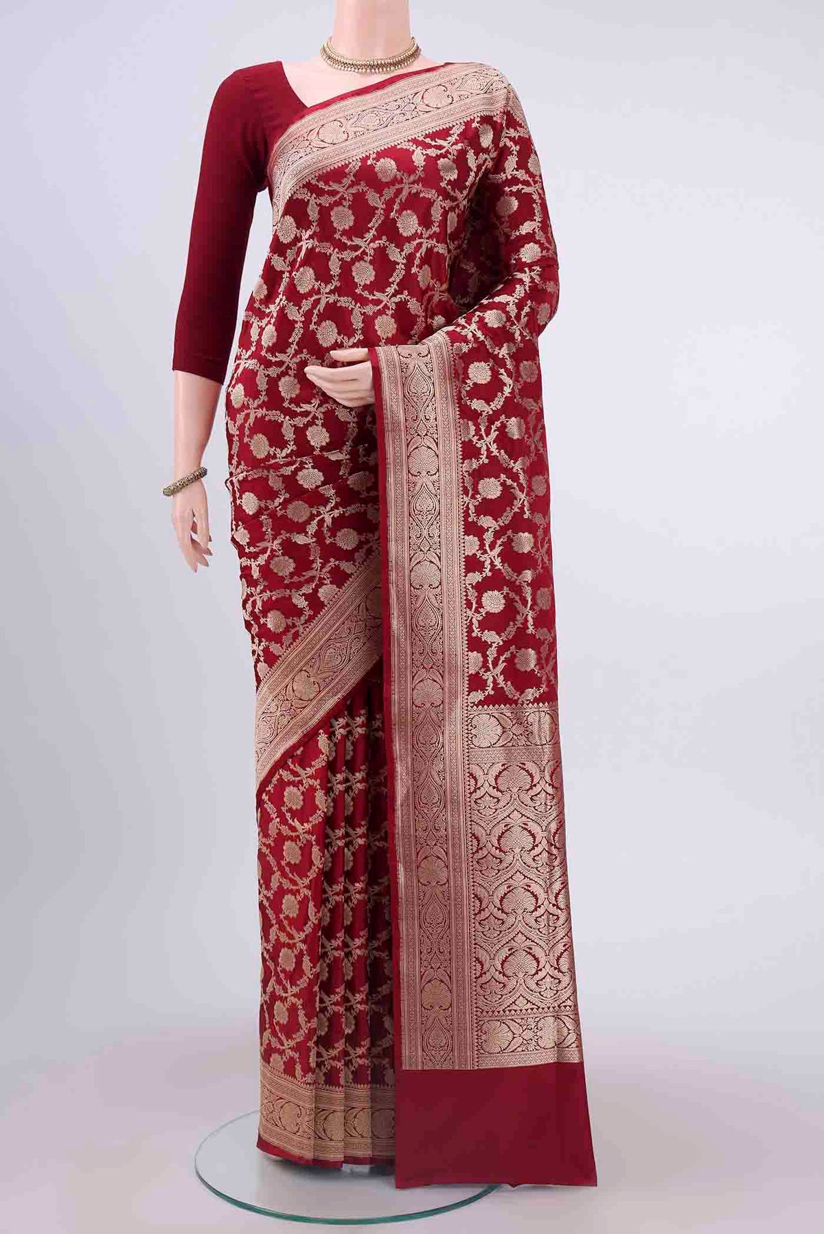 Maroon Banarasi Silk Saree with Zari Brocade on the body and Zari Border displayed on a mannequin