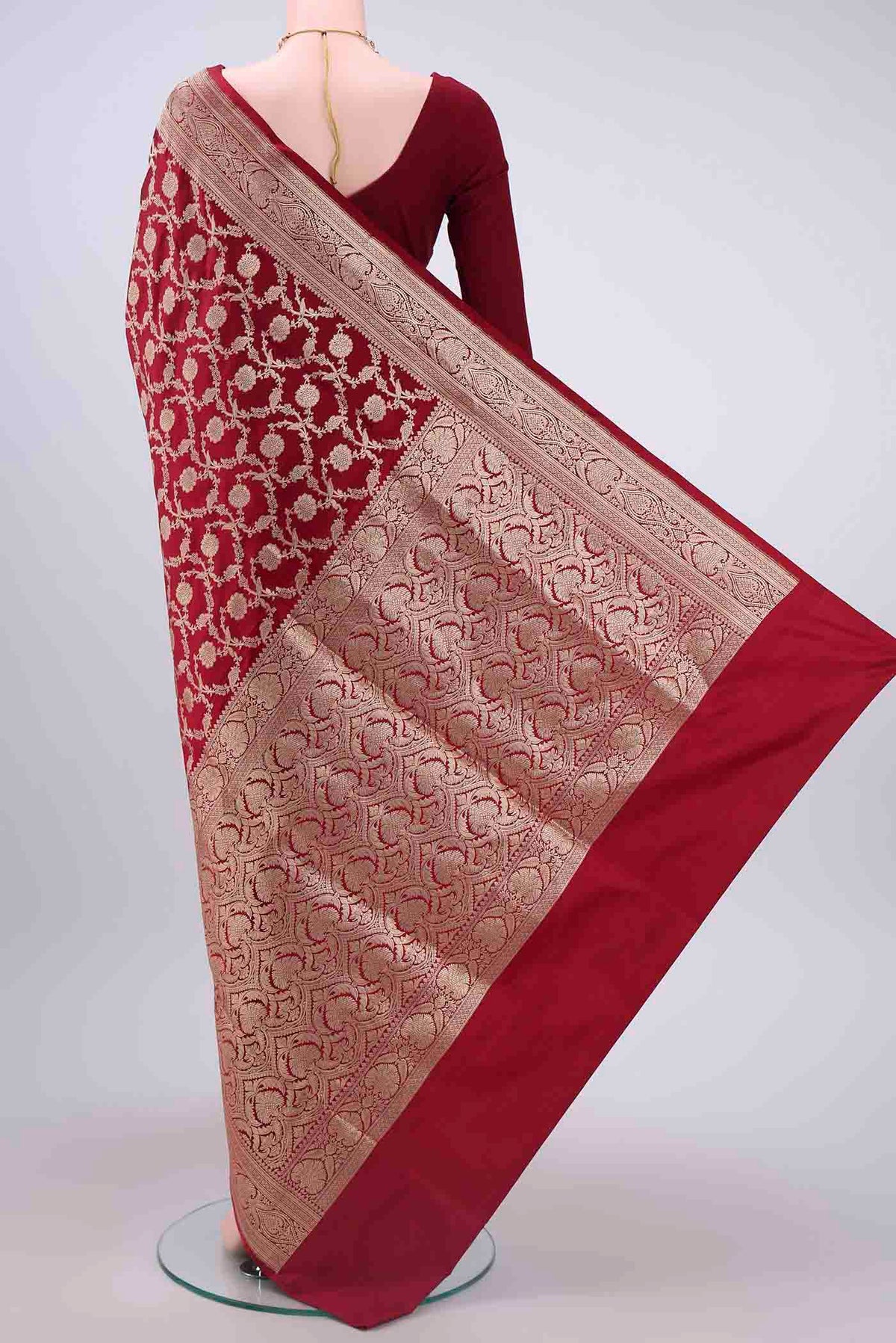 Flat view of Maroon Banarasi Silk Saree with Zari Brocade on the body and Zari Border