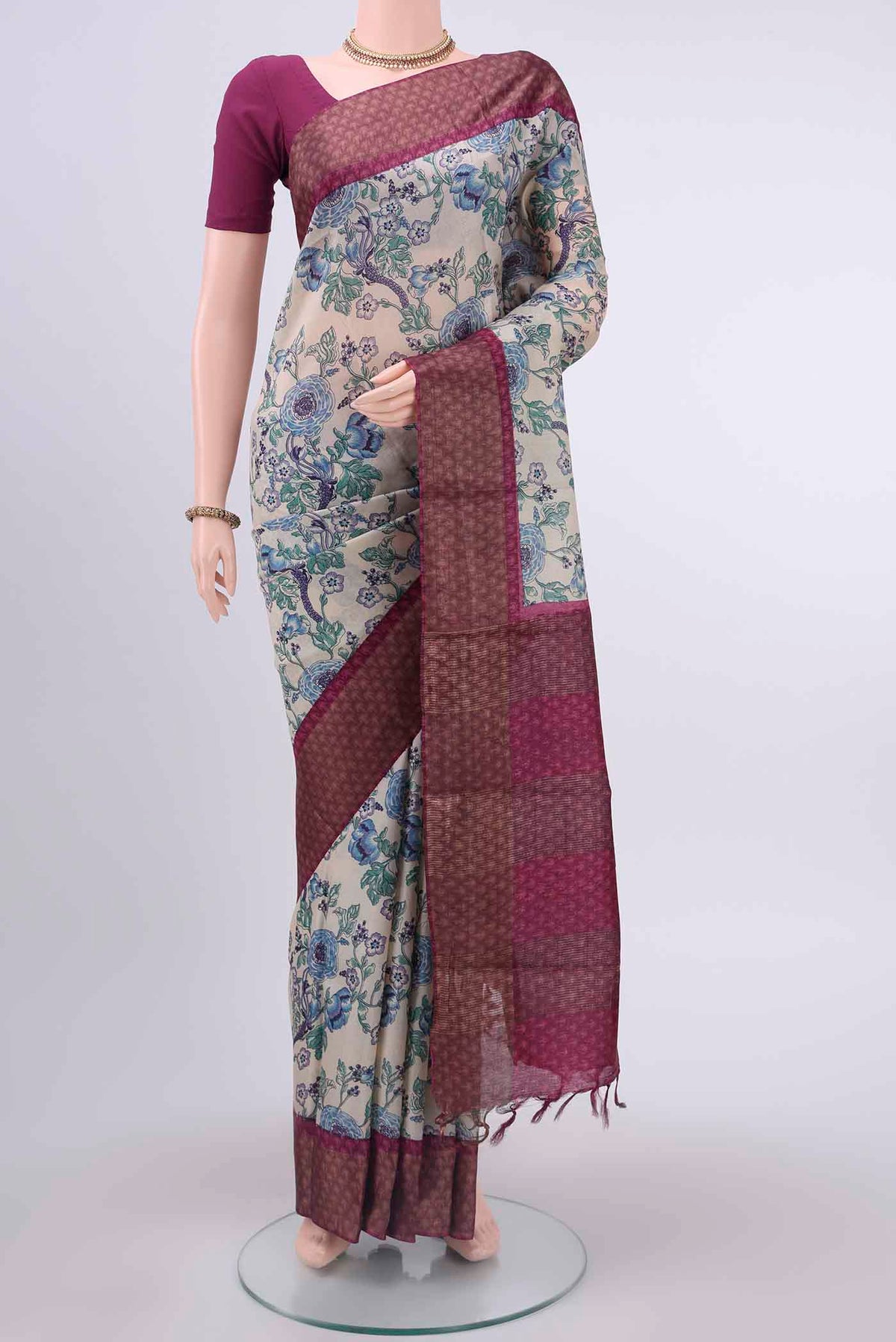 Off White Dual Tone Tussar Silk Saree with Printed design on the body and Zari Border displayed on a mannequin