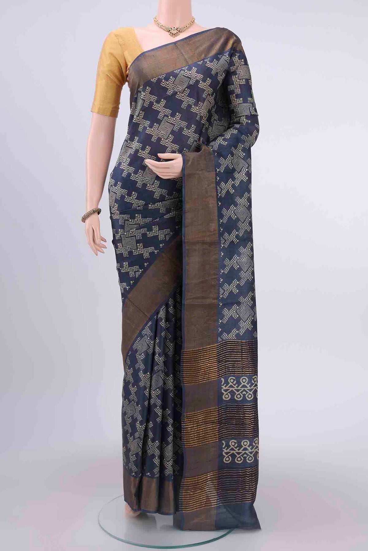 Davys Grey Dual Tone Tussar Silk Saree with Printed design on the body and Zari Border displayed on a mannequin