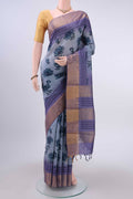 Light Blue Dual Tone Tussar Silk Saree with Printed design on the body and Zari Border displayed on a mannequin
