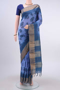 Blue Tussar Silk Saree with Printed design on the body and Zari Border displayed on a mannequin