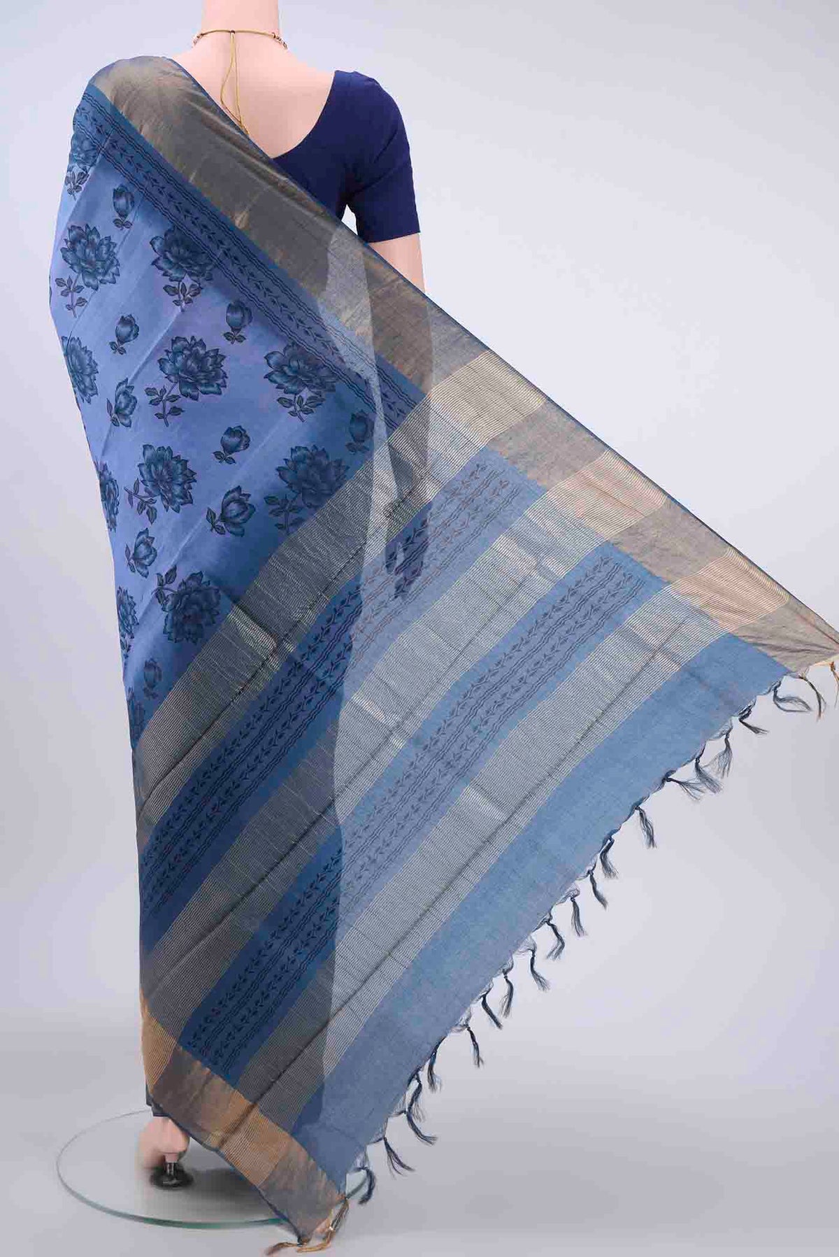 Flat view of Blue Tussar Silk Saree with Printed design on the body and Zari Border