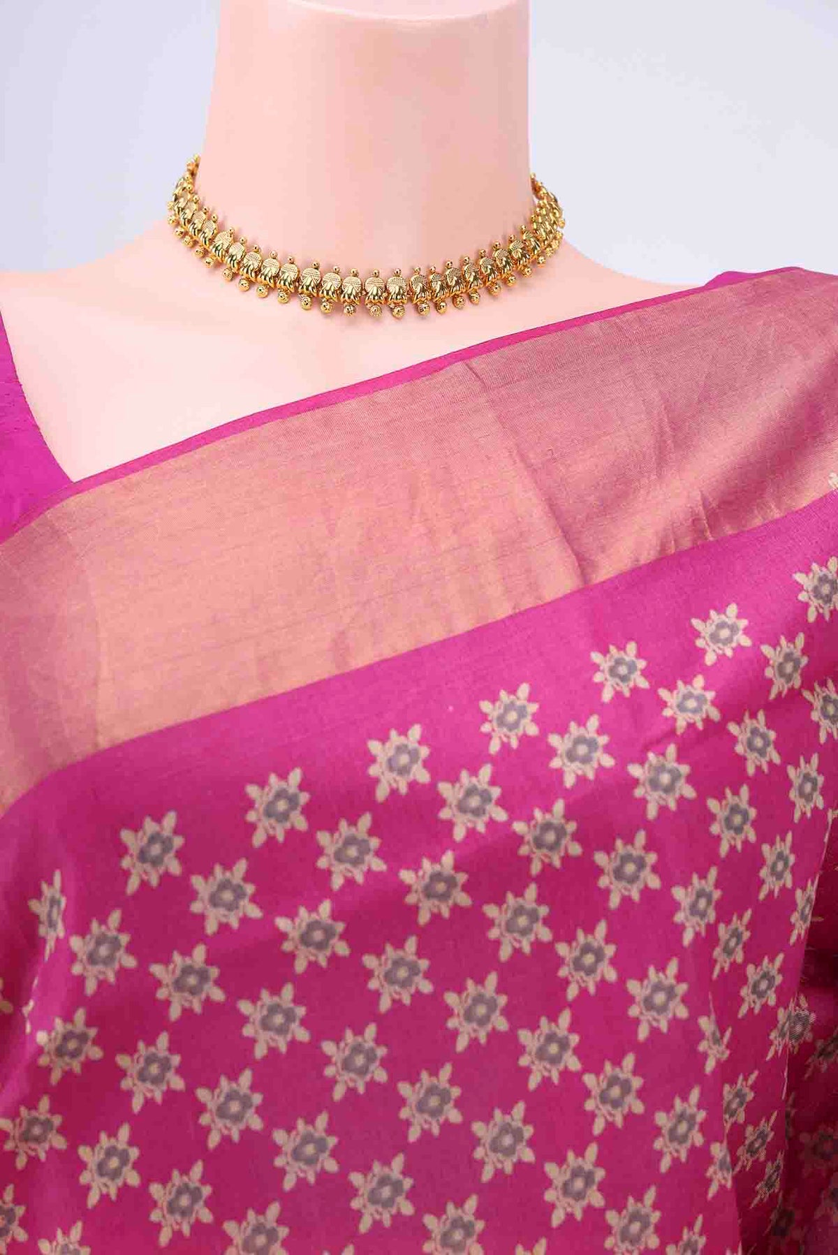 Border image of Rani Pink Dual Tone Tussar Silk Saree with Printed design on the body and Zari Border