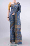 Light Blue Dual Tone Tussar Silk Saree with Printed design on the body and Zari Border displayed on a mannequin