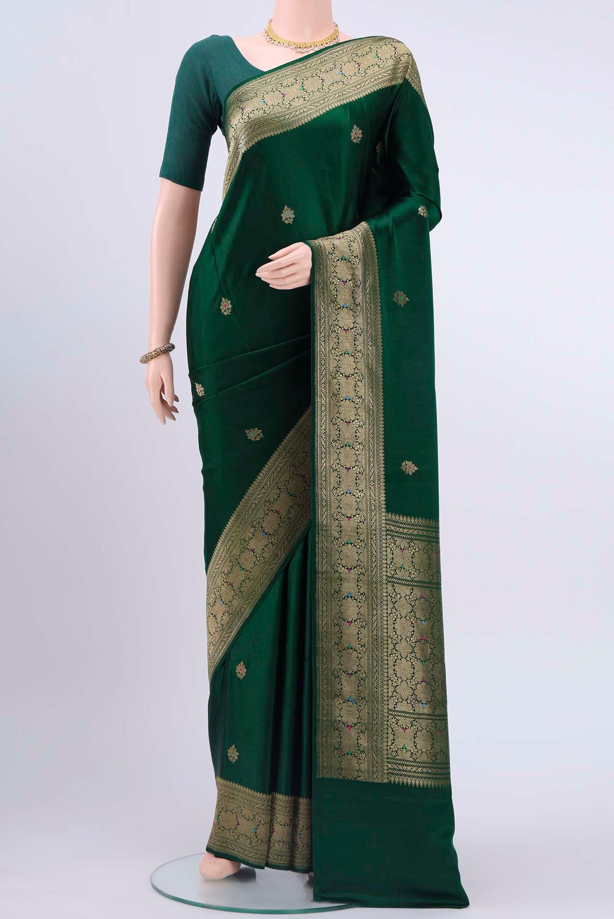 Bottle Green Dual Tone Banarasi Silk Saree with Zari And Thread Butta on the body and Zari And Thread Border displayed on a mannequin