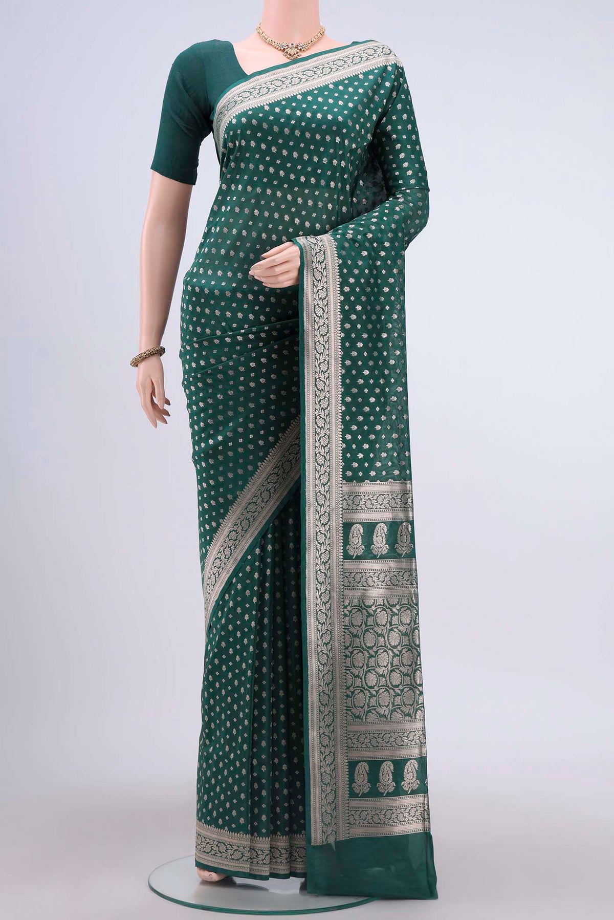 Green Banarasi Silk Saree with Zari Butta on the body and Zari Border displayed on a mannequin