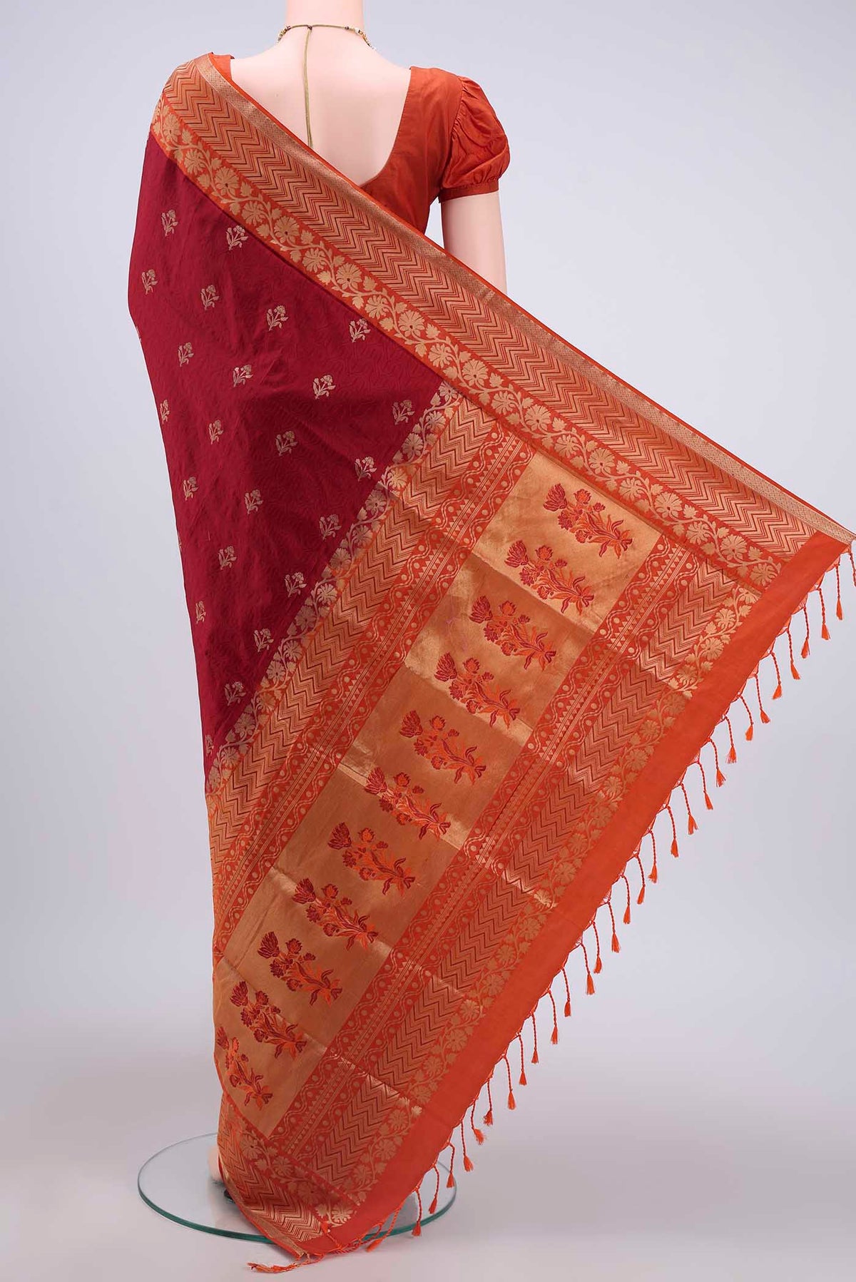 Flat view of Maroon Soft Silk Saree with Jacquard design on the body and Zari Border
