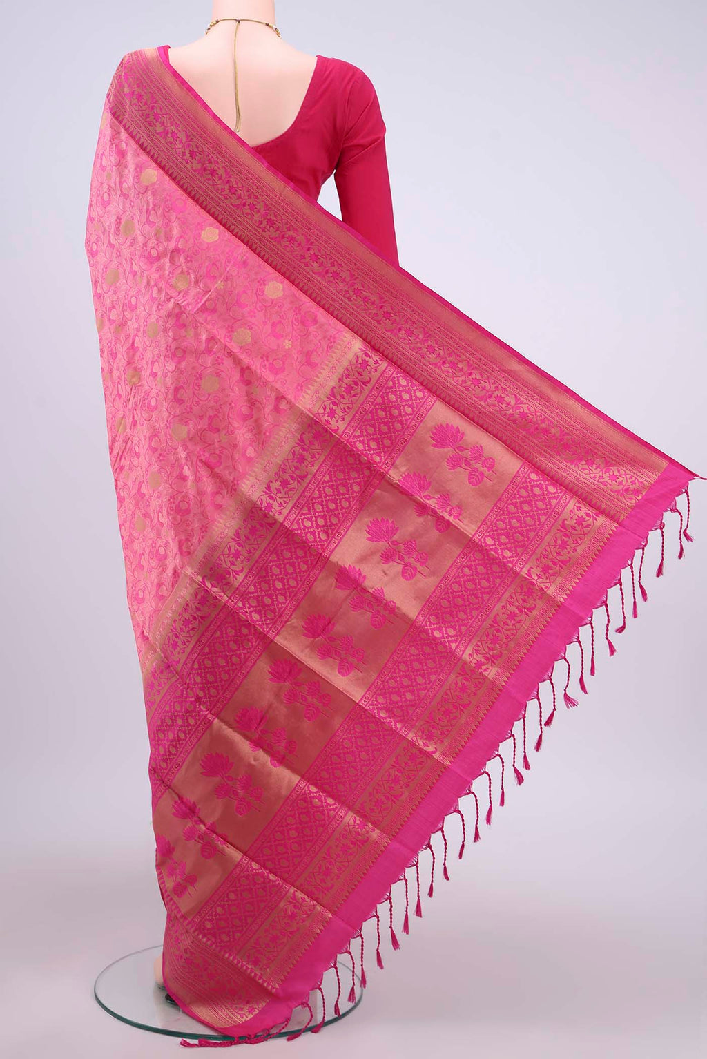Flat view of Rani Pink Soft Silk Saree with Jacquard design on the body and Zari Border