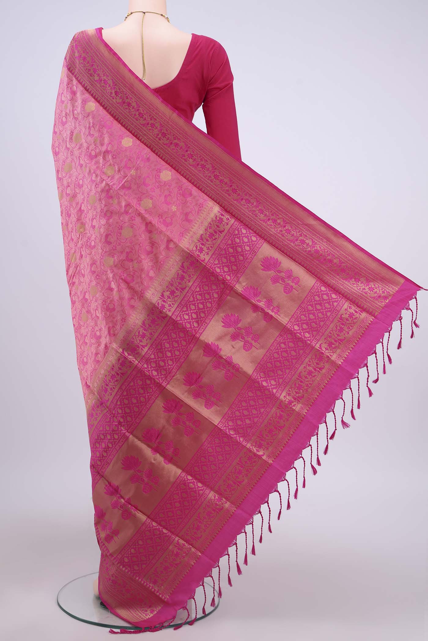 Flat view of Rani Pink Soft Silk Saree with Jacquard design on the body and Zari Border