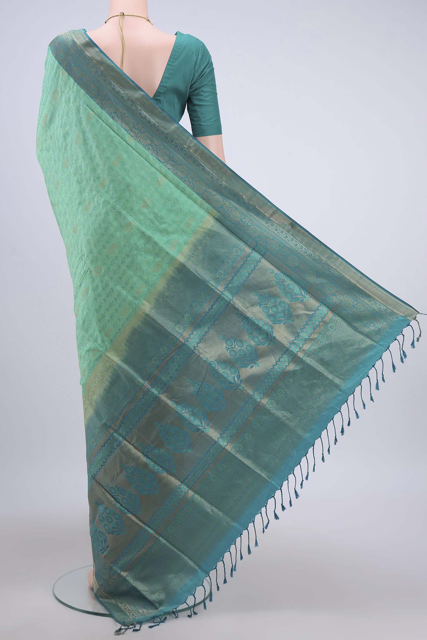 Flat view of Turquoise Soft Silk Saree with Jacquard design on the body and Zari Border