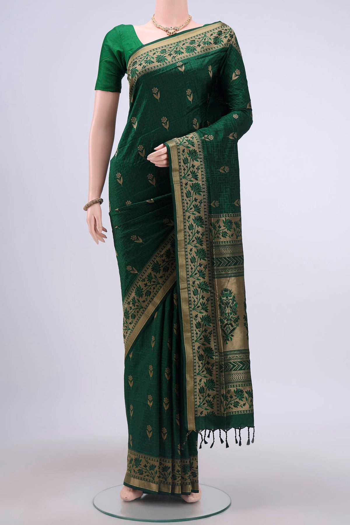 Green Soft Silk Saree with Jacquard design on the body and Thread Border displayed on a mannequin
