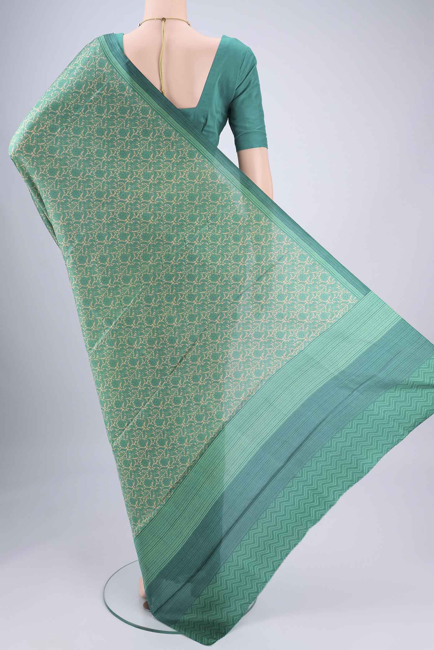 Flat view of Beige Printed Silk Saree with Floral Print on the body and Printed Border. 
