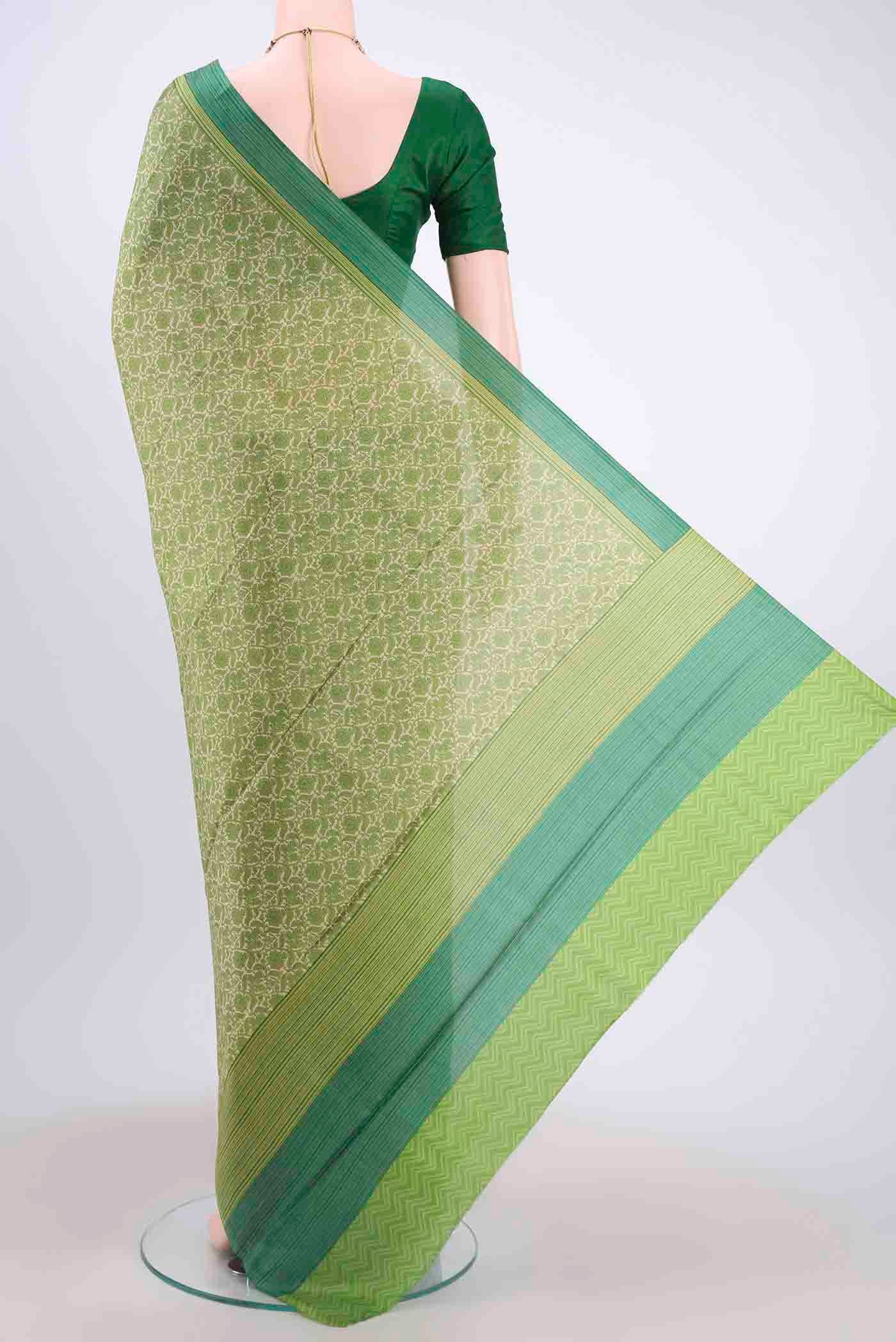 Flat view of Cream Printed Silk Saree with Printed design on the body and Printed Border