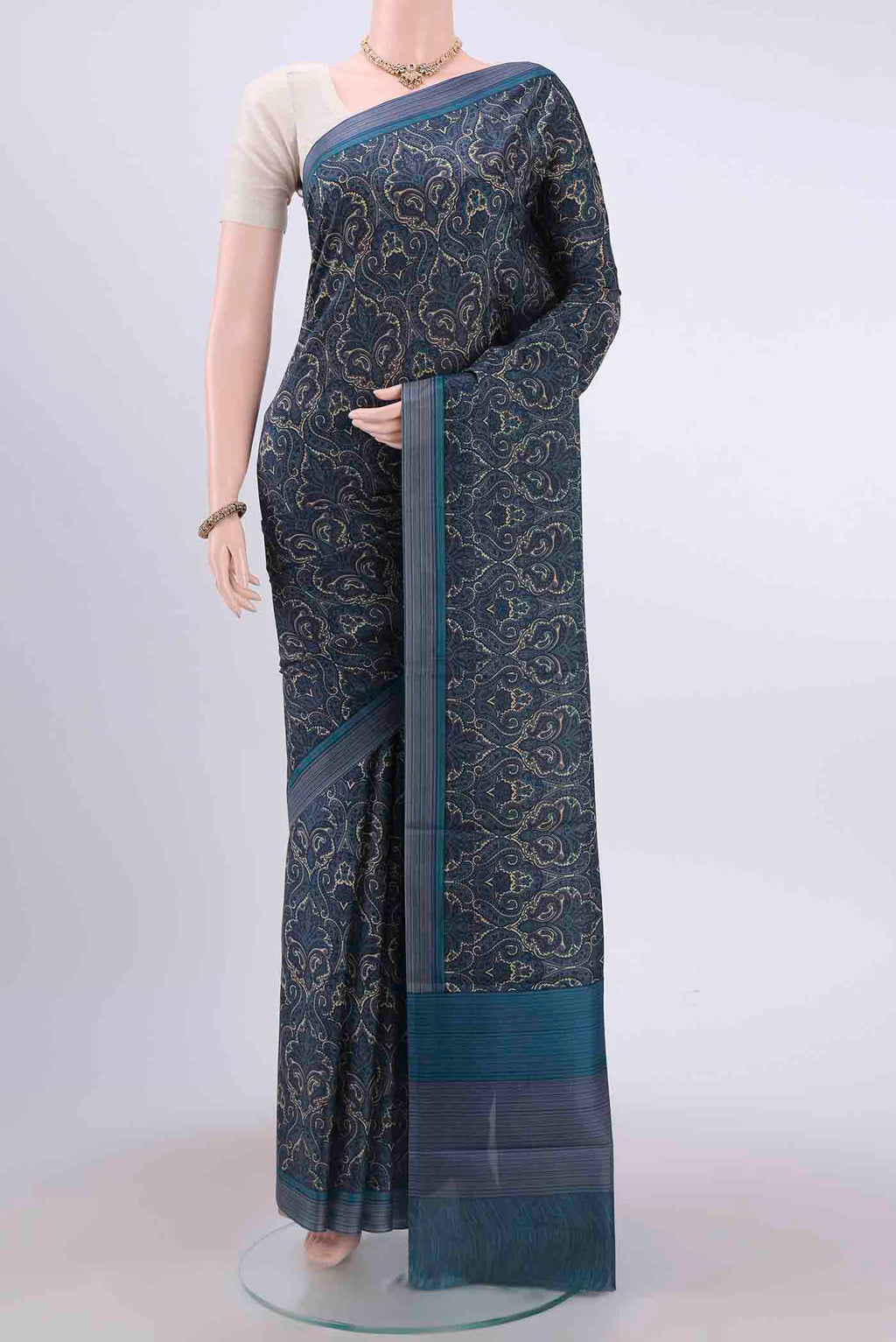 Dark Blue Printed Silk Saree with Floral Print on the body and Plain Border displayed on a mannequin