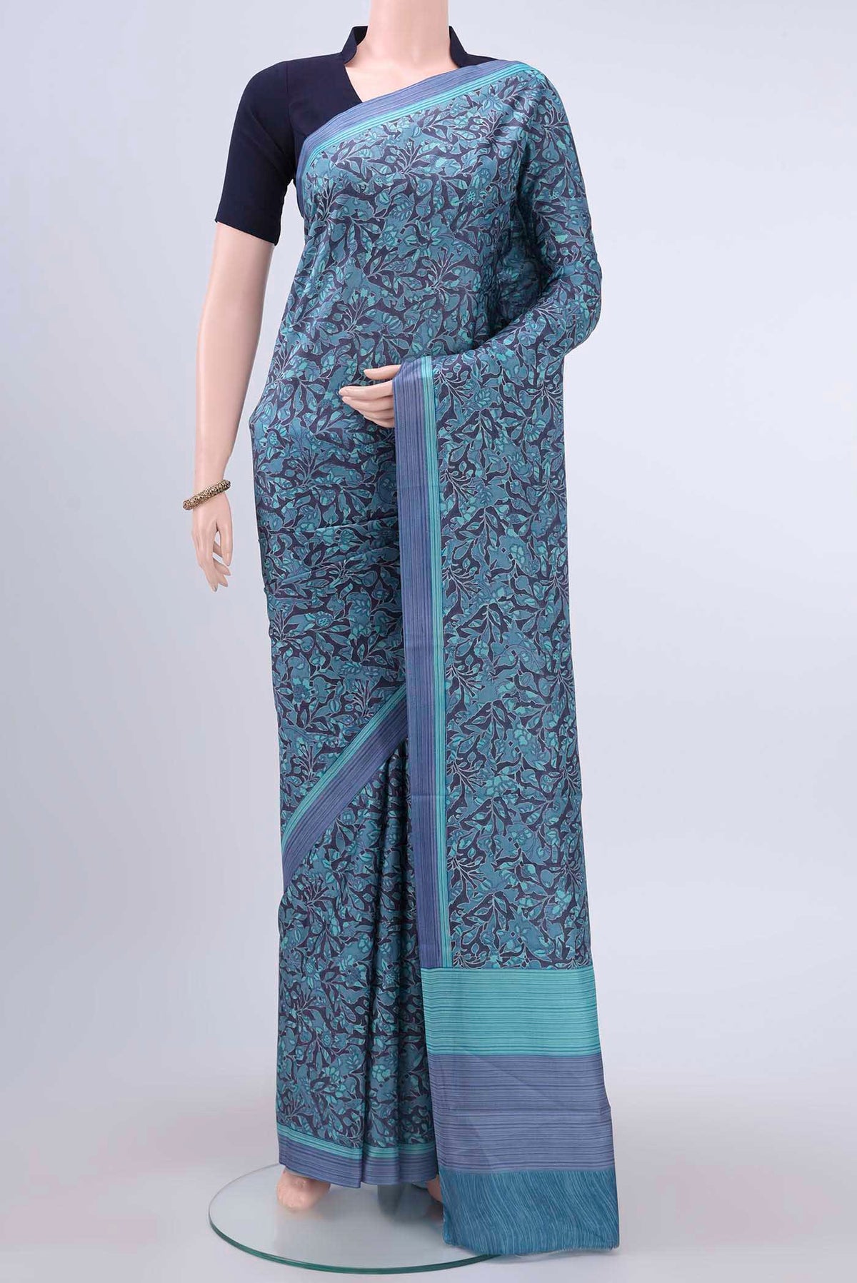 Davys Grey Printed Silk Saree with Printed design on the body and Lace Border displayed on a mannequin