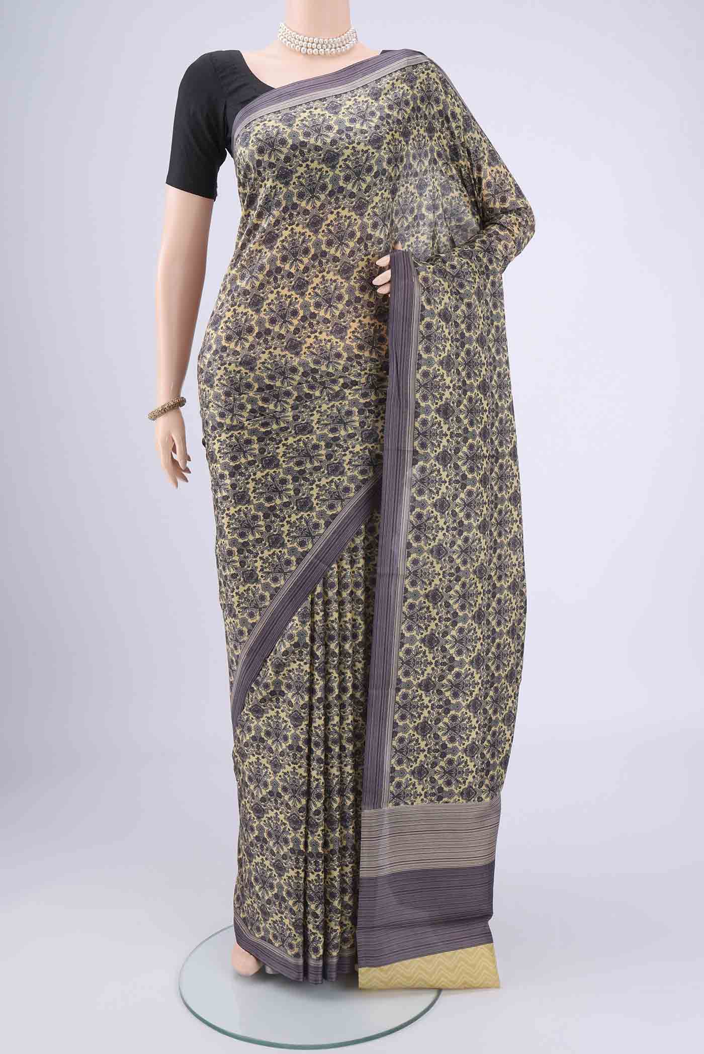 Cream Dual Tone Printed Silk Saree with Printed design on the body and Zari Border.  displayed on a mannequin