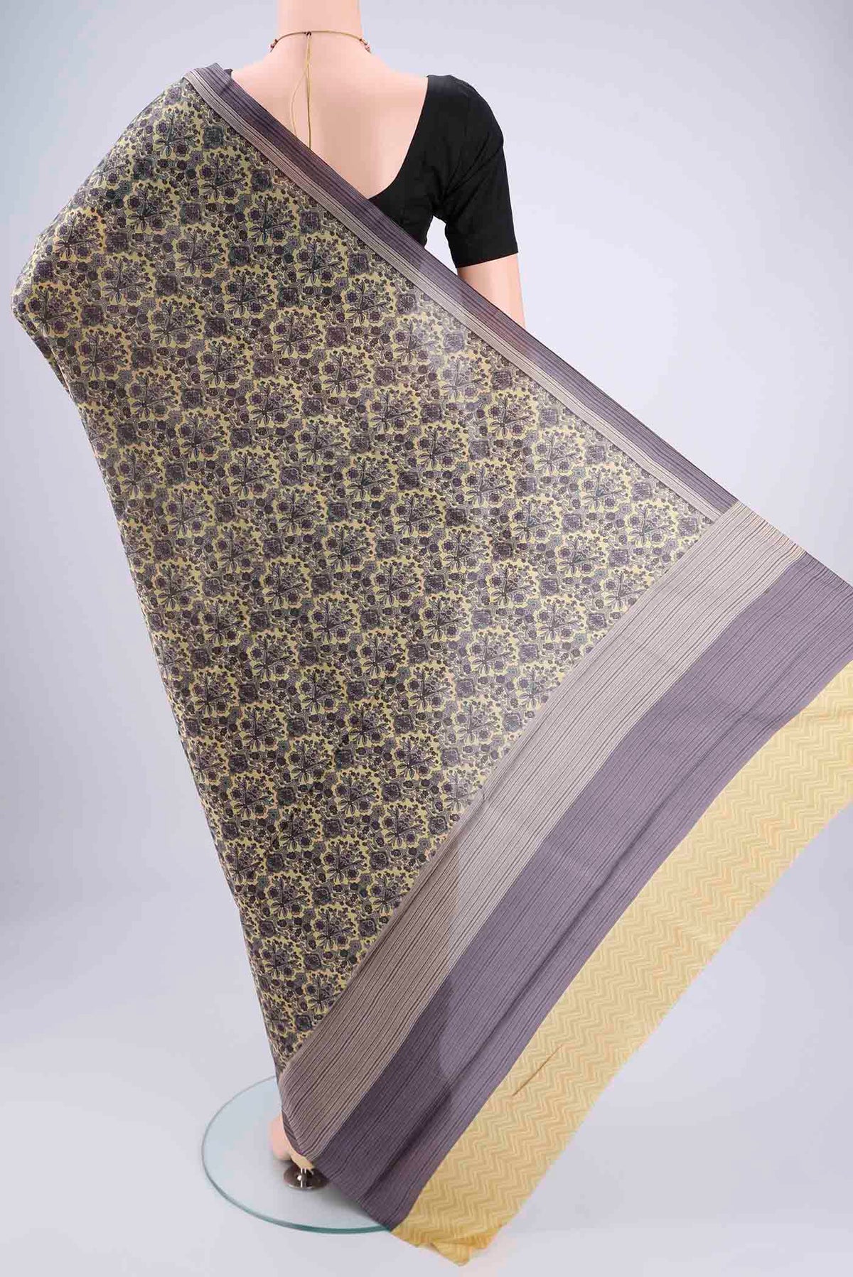Flat view of Cream Dual Tone Printed Silk Saree with Printed design on the body and Zari Border. 