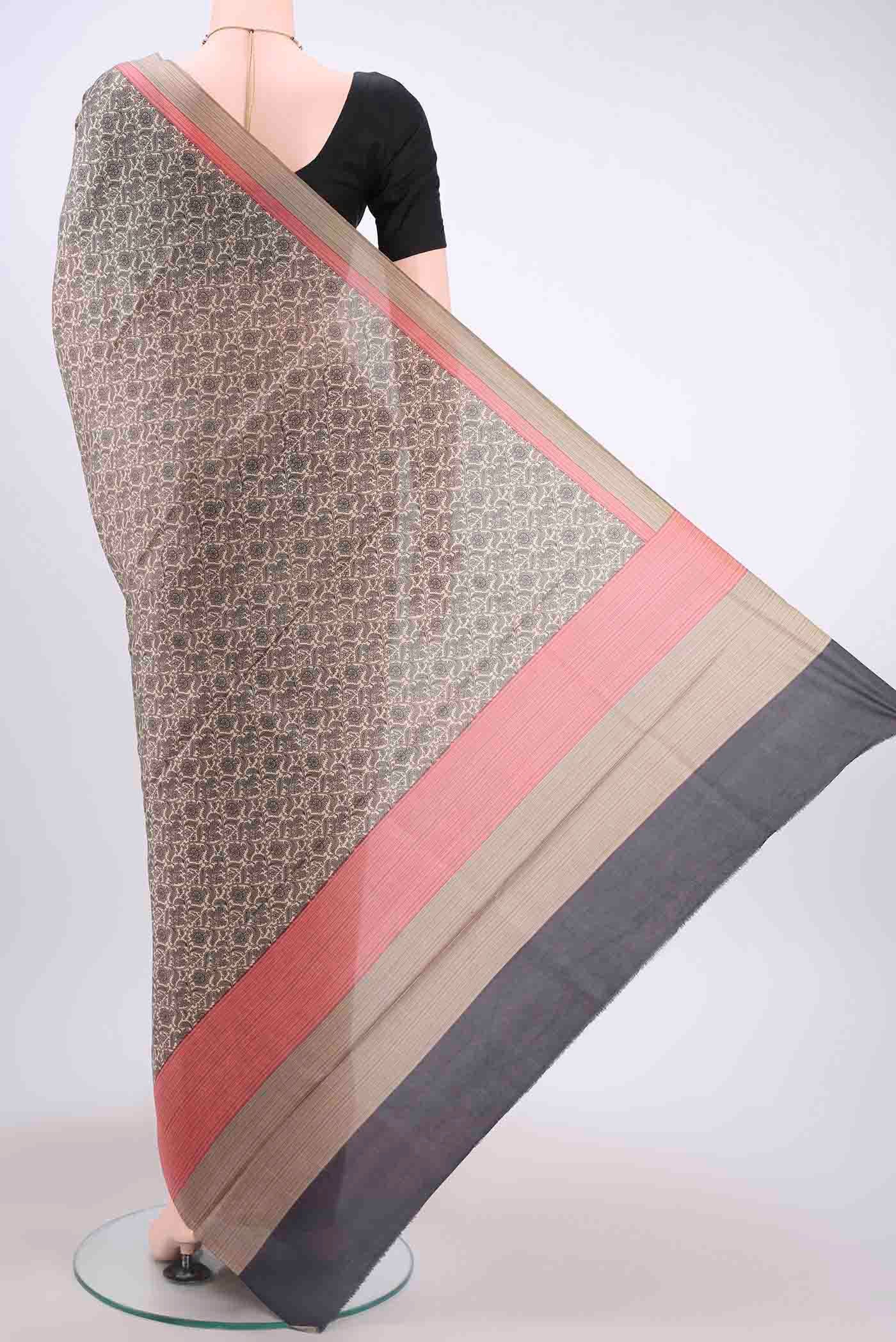 Flat view of Cream Printed Silk Saree with Printed design on the body and Printed Border