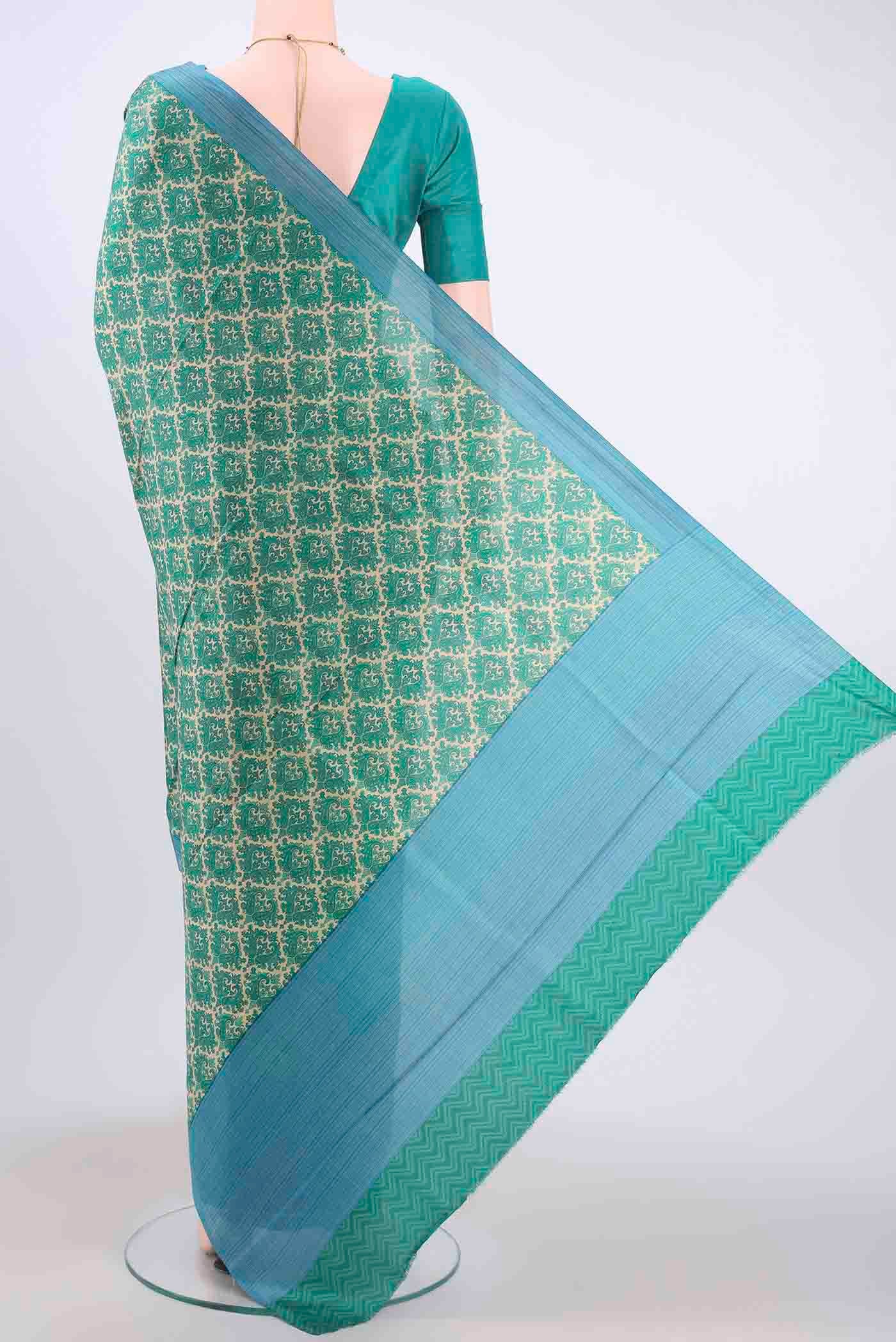 Flat view of Cream Printed Silk Saree with Printed design on the body and Printed Border