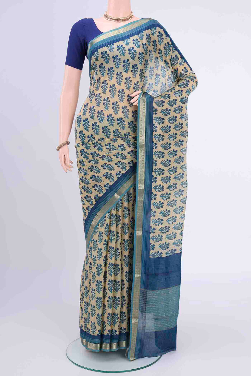 Beige Mysore Crepe Saree with Floral Print on the body and Printed Border displayed on a mannequin