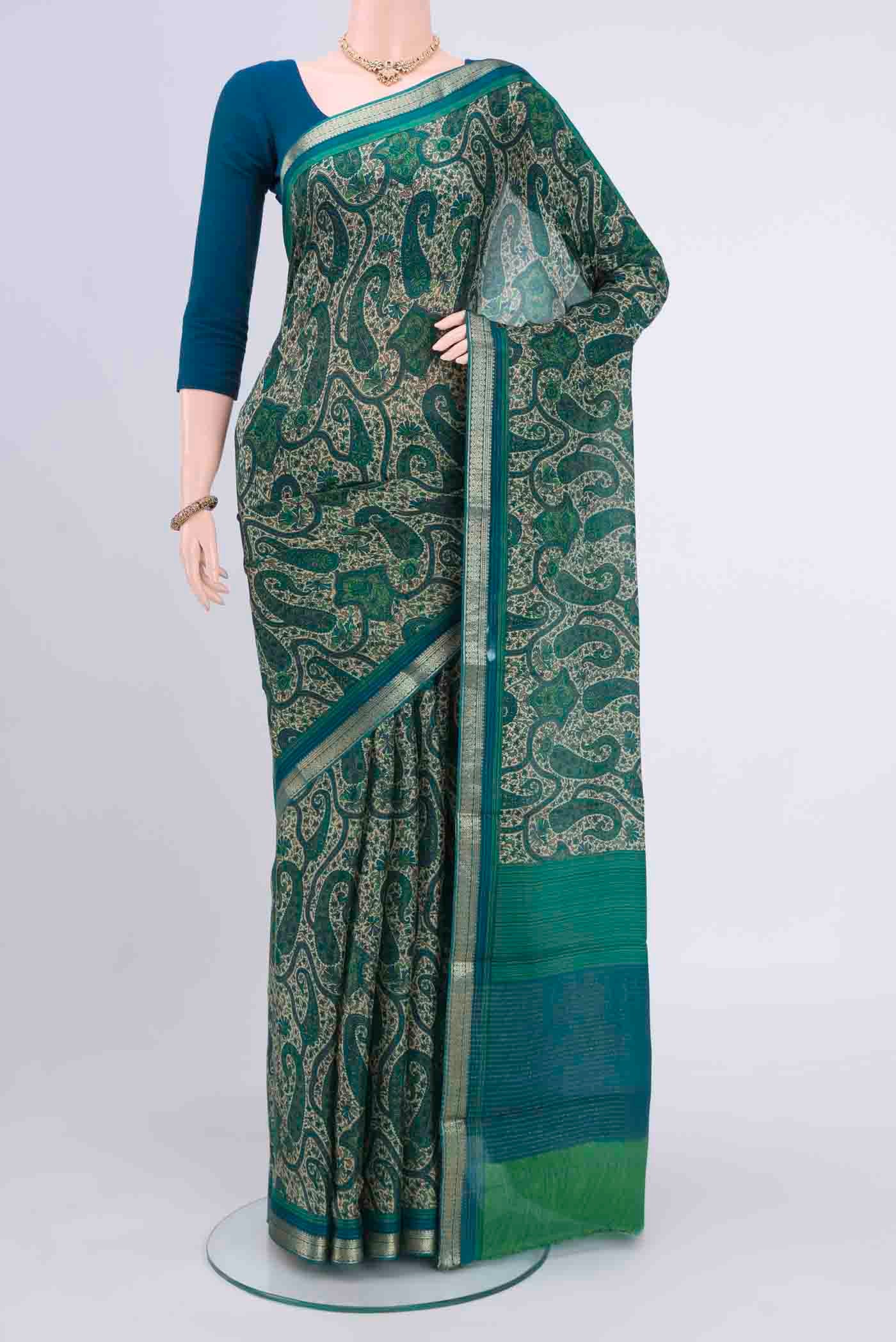 Cream Mysore Crepe Saree with Floral Print on the body and Zari Border displayed on a mannequin