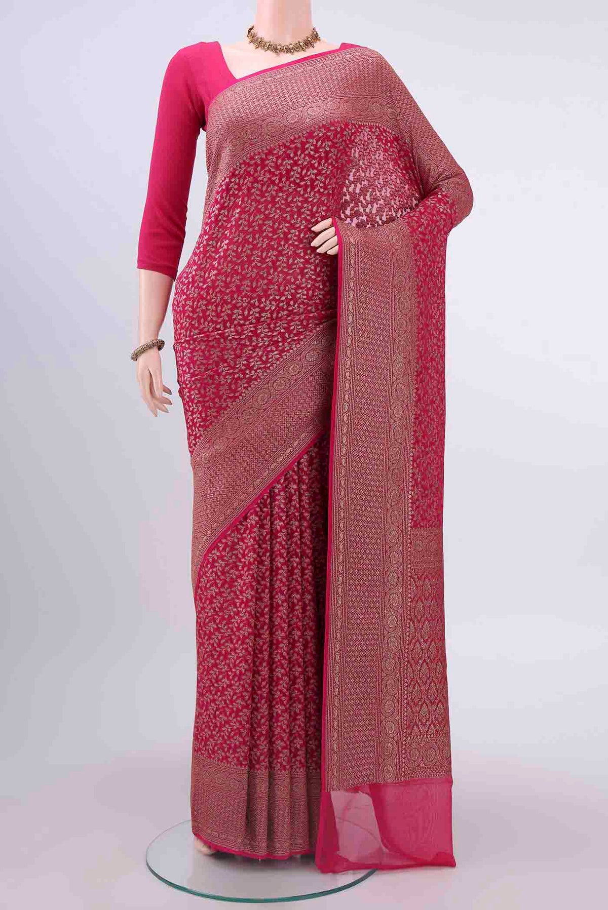 Dark Pink Banarasi Georgette Saree with Zari Brocade on the body and Zari Border displayed on a mannequin