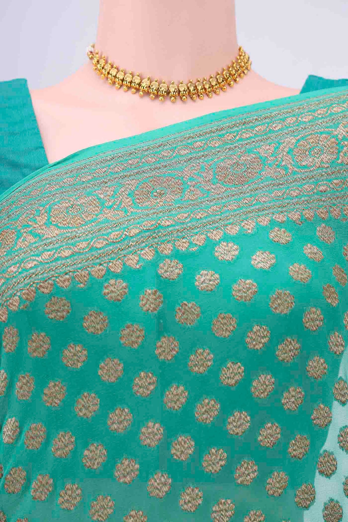 Border image of Sea Green Banarasi Georgette Saree with Zari Brocade on the body and Zari Border