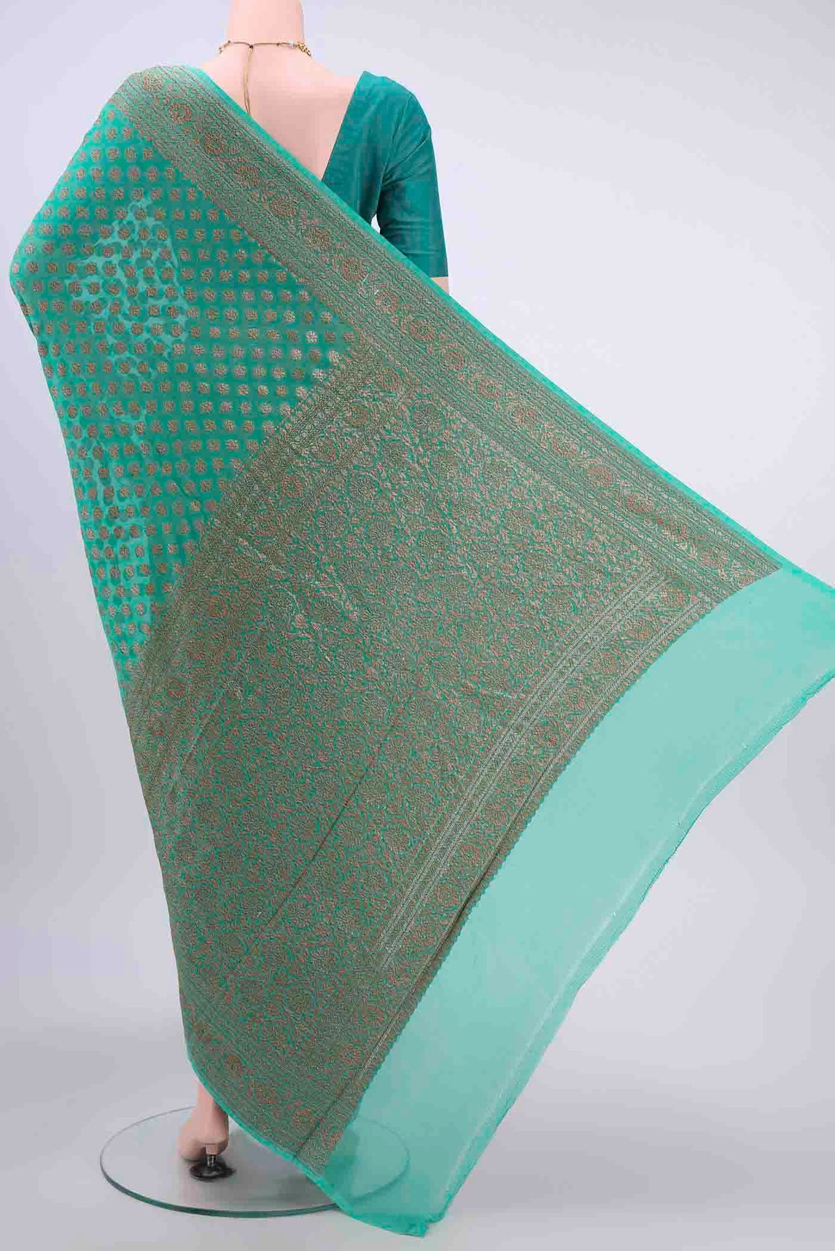Flat view of Sea Green Banarasi Georgette Saree with Zari Brocade on the body and Zari Border