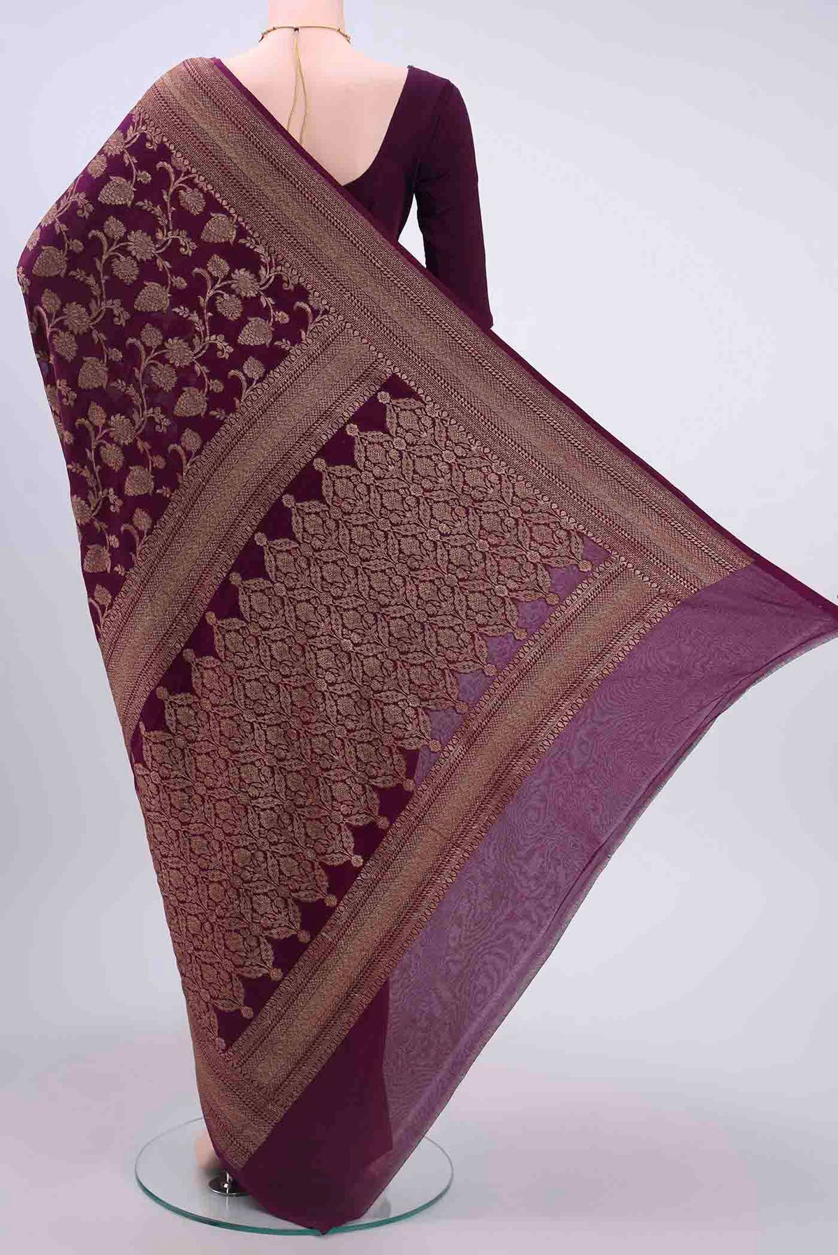 Flat view of Burgundy Banarasi Georgette Saree with Zari Brocade on the body and Zari Border
