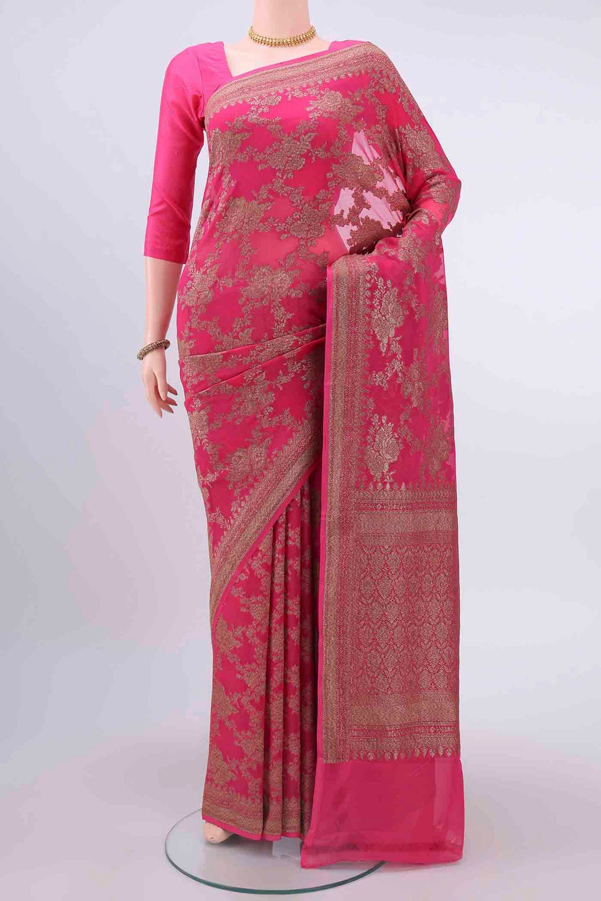 Dark Pink Banarasi Georgette Saree with Zari Brocade on the body and Zari Border displayed on a mannequin