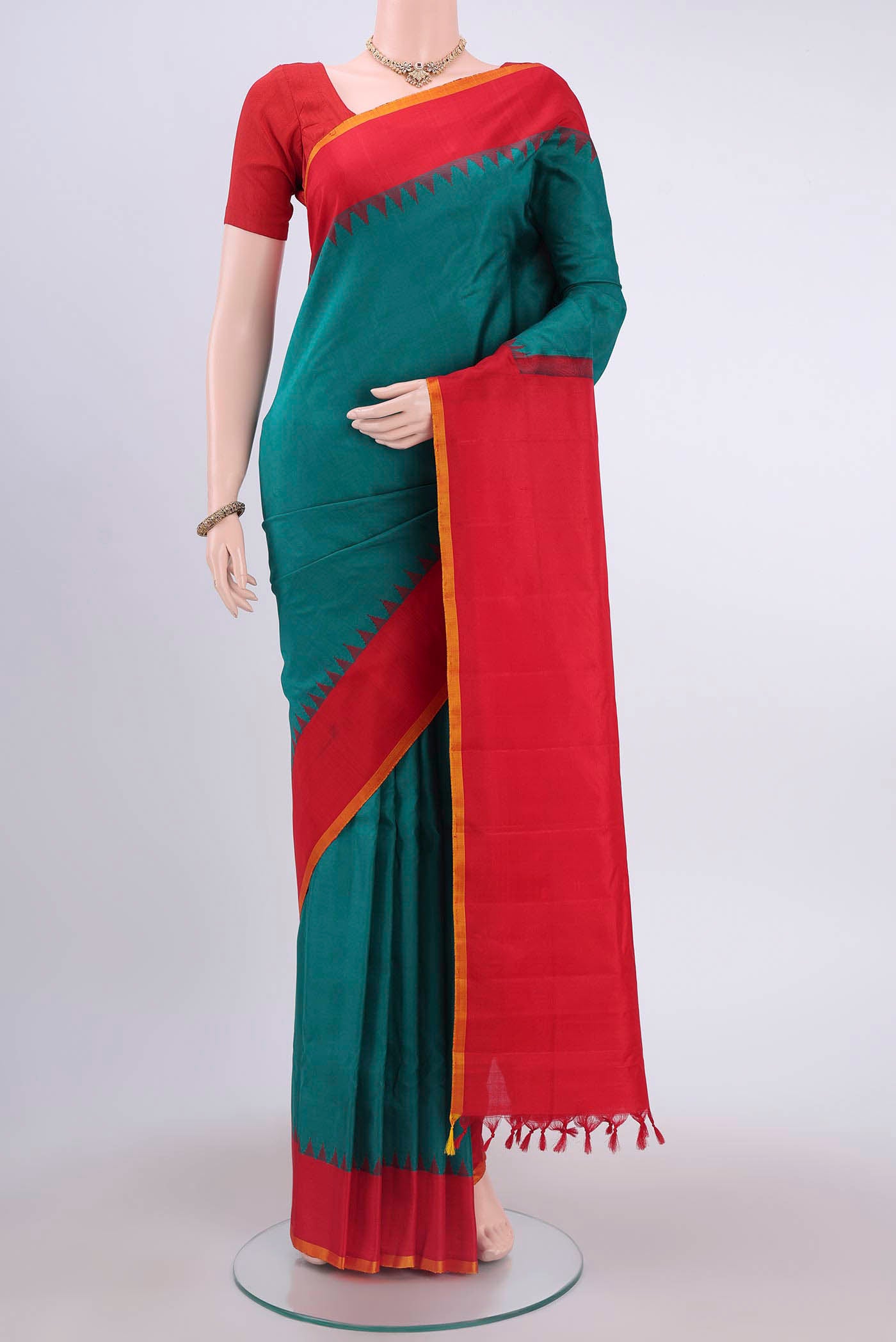 Sea Green Gadwal Silk Saree with Plain Body and Zari Border displayed on a mannequin