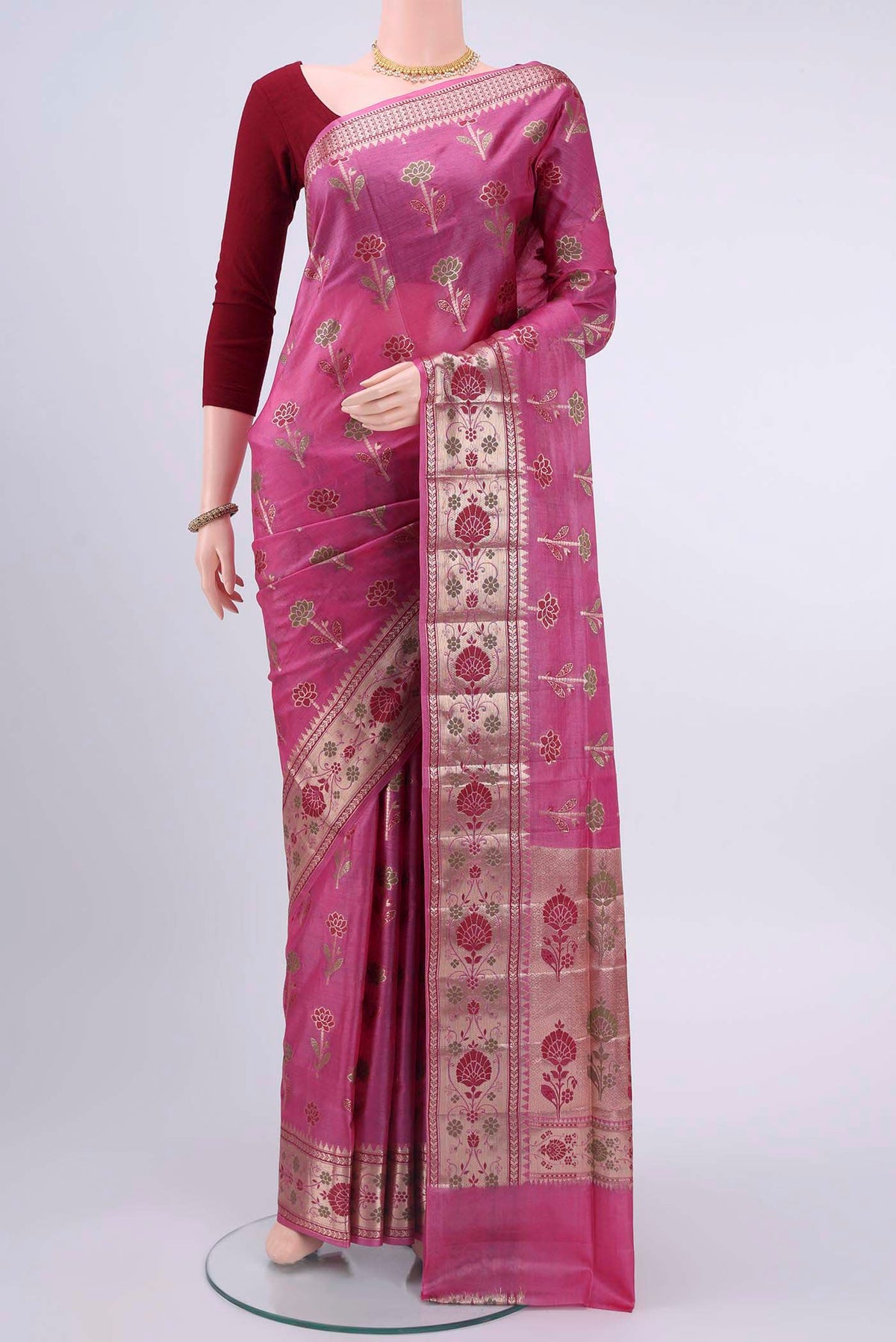 Dark Pink Banarasi Raw Silk Saree with Zari And Thread Butta on the body and Zari Border displayed on a mannequin